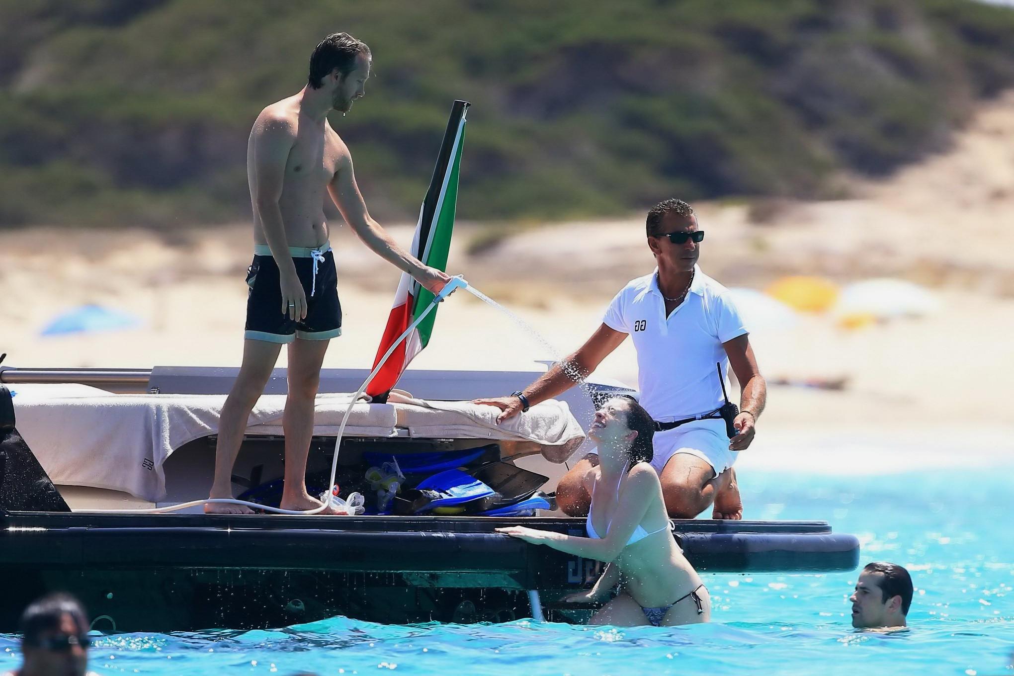 16P Anne Hathaway busty in a tiny twopiece at the yacht