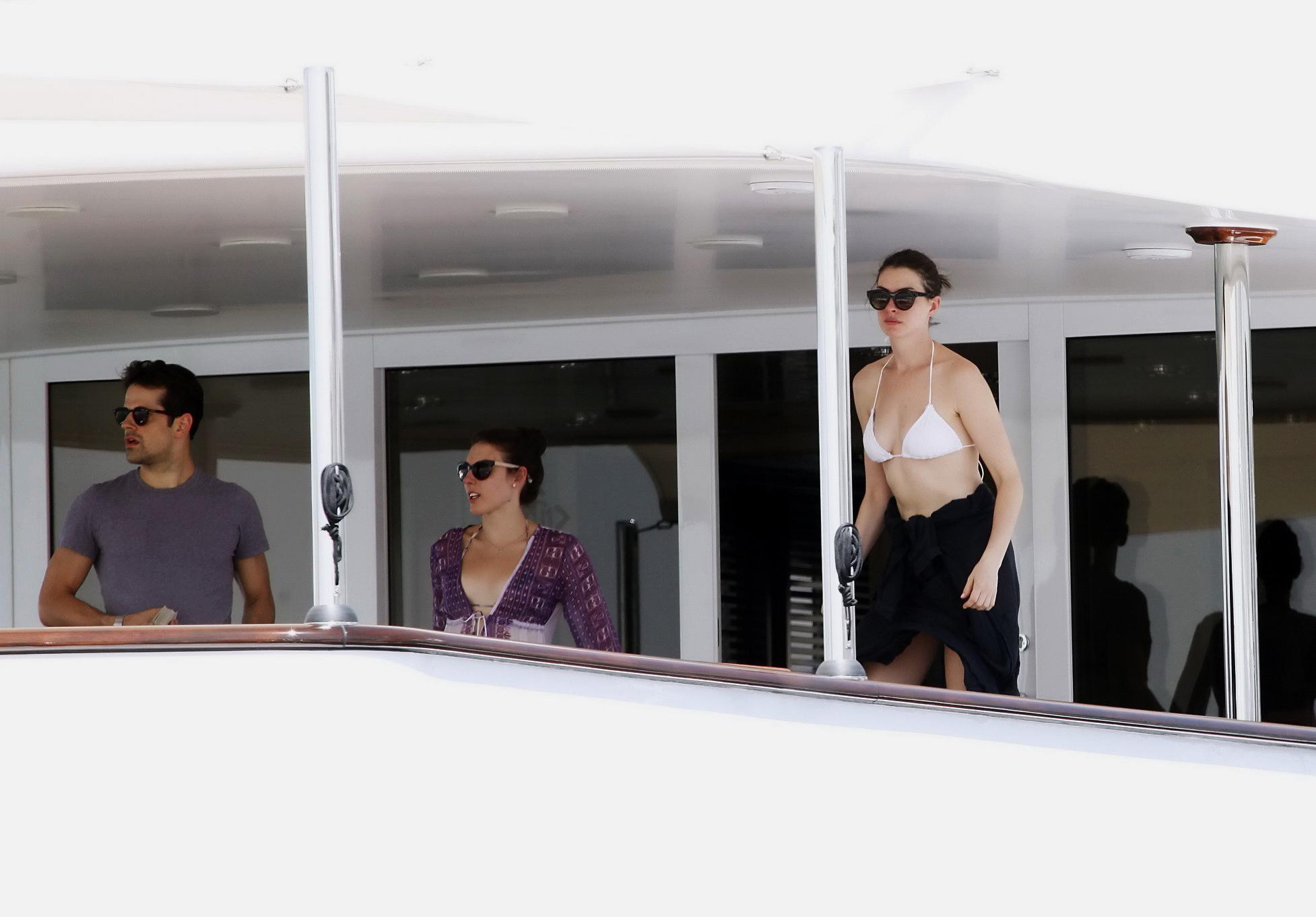 16P Anne Hathaway busty in a tiny twopiece at the yacht