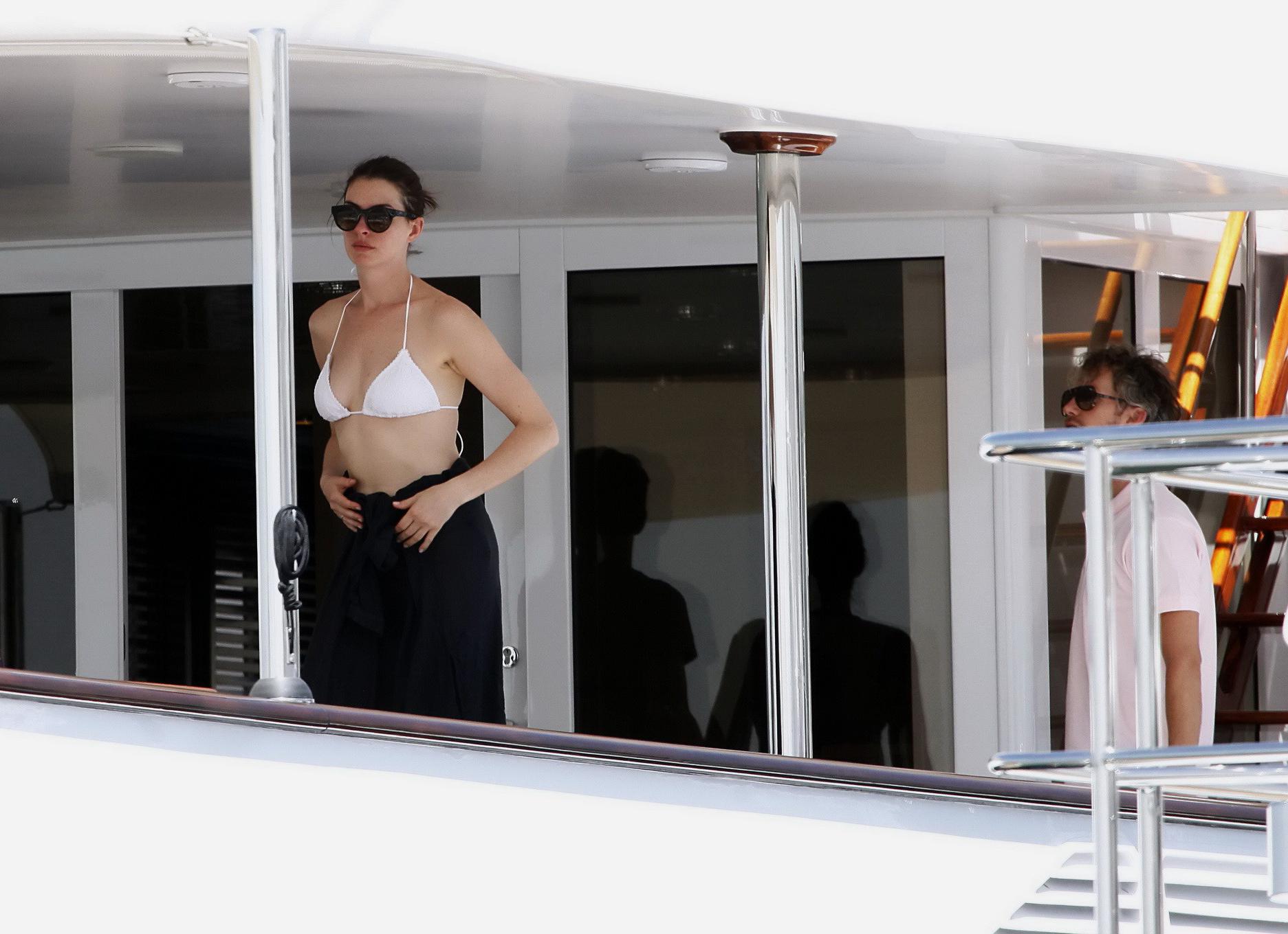 16P Anne Hathaway busty in a tiny twopiece at the yacht