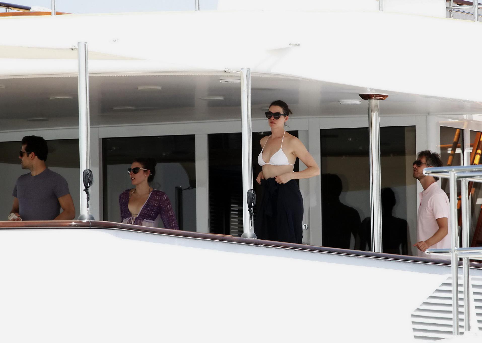 16P Anne Hathaway busty in a tiny twopiece at the yacht
