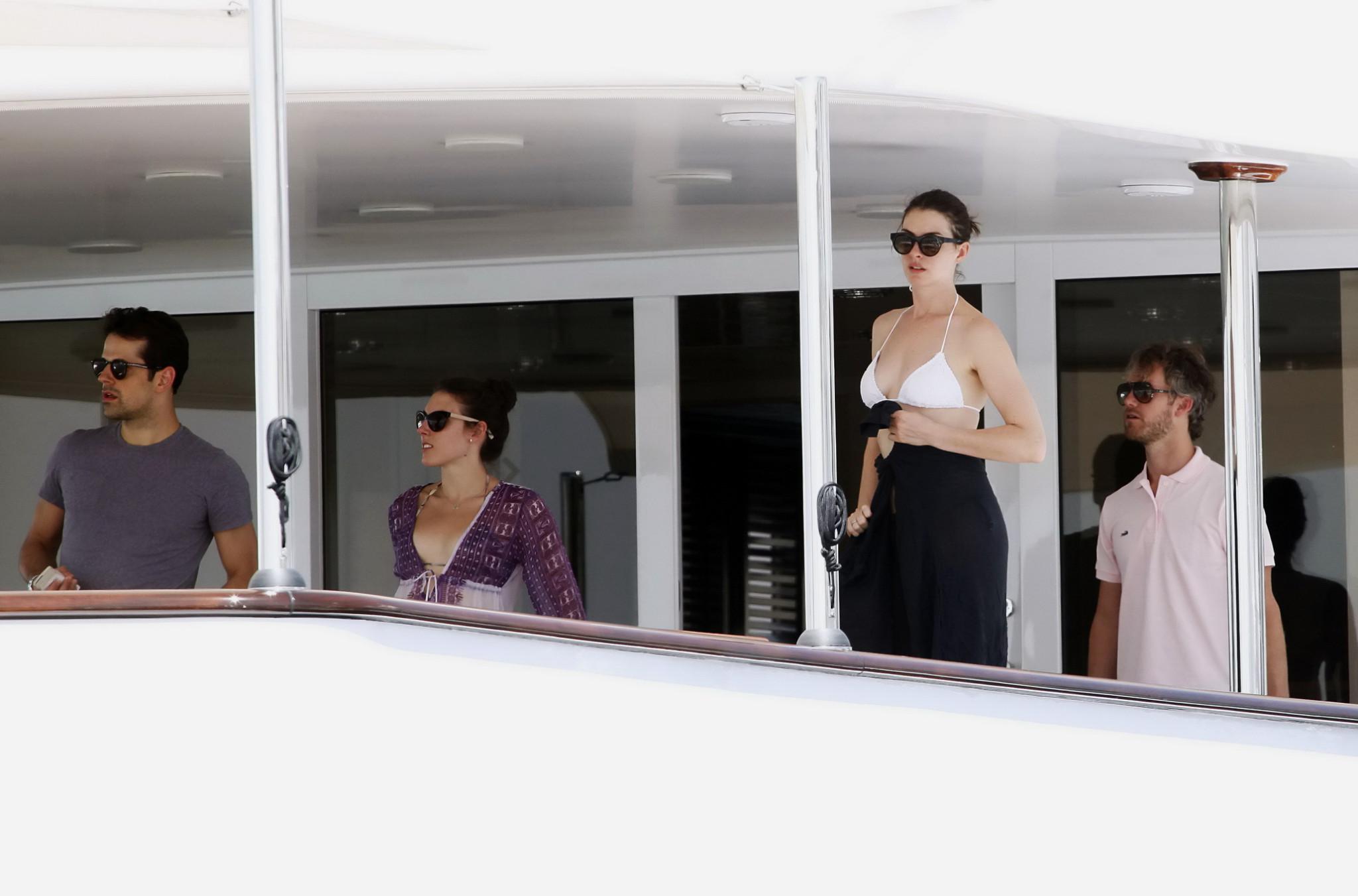 16P Anne Hathaway busty in a tiny twopiece at the yacht