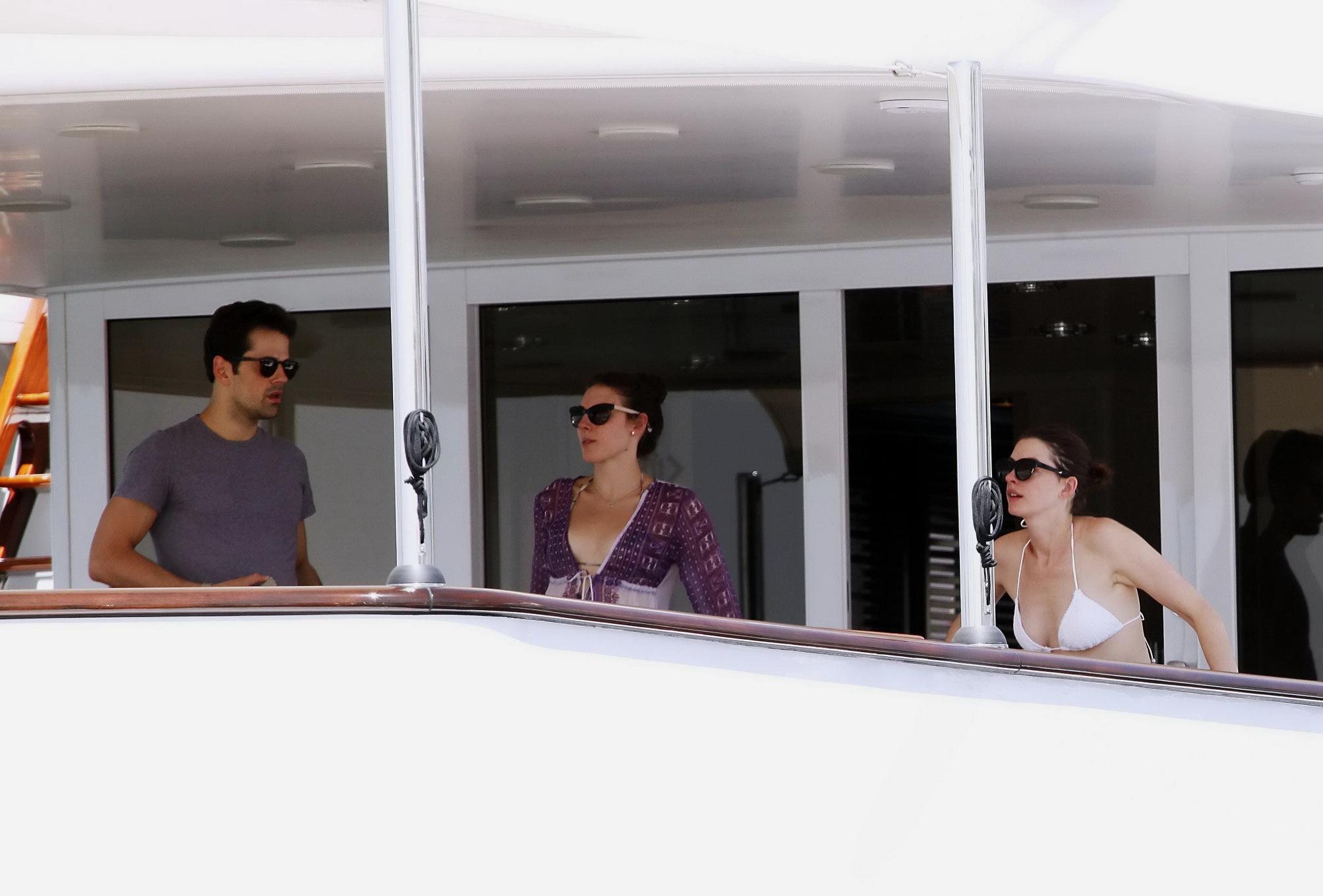 16P Anne Hathaway busty in a tiny twopiece at the yacht