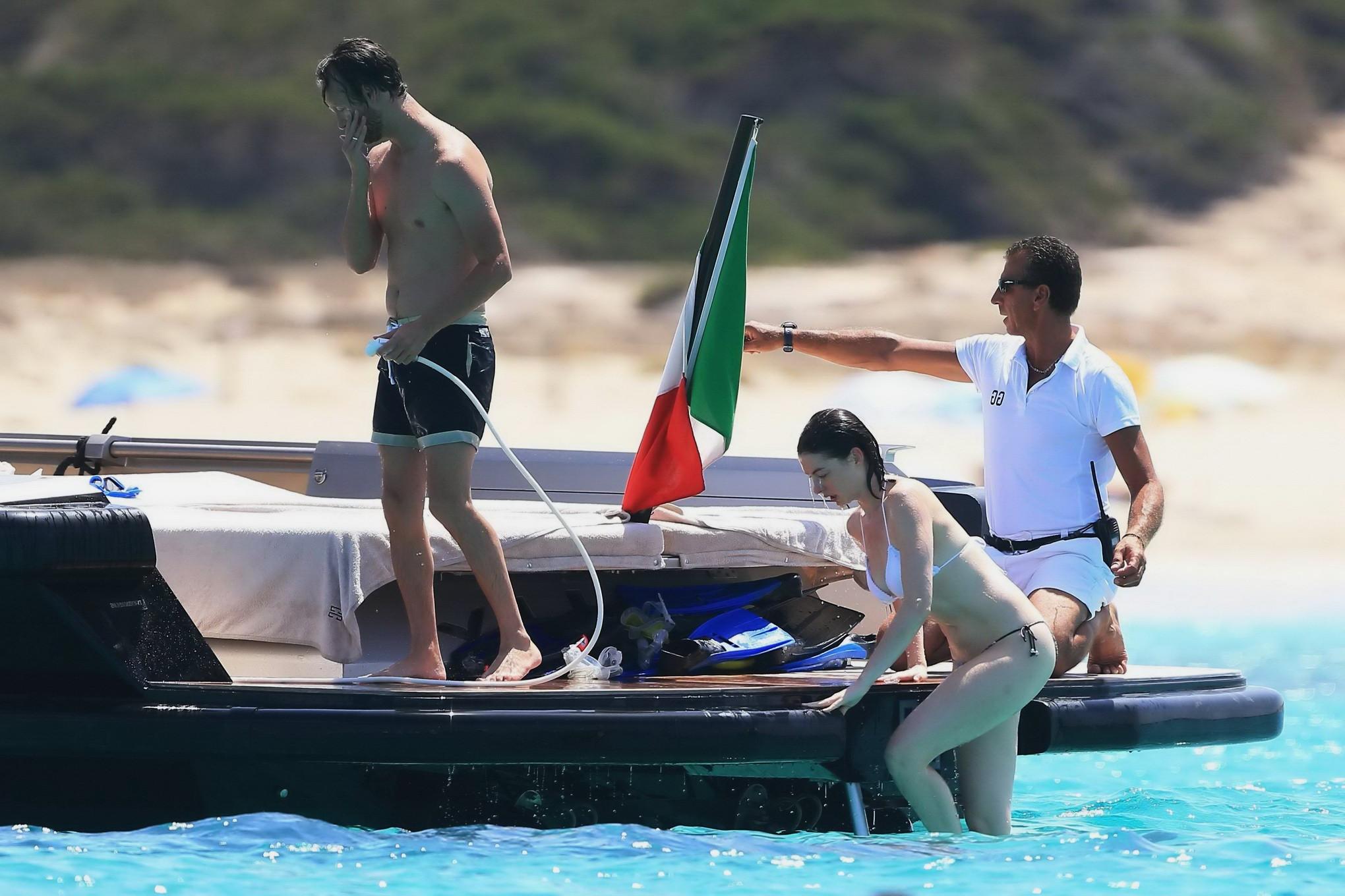 16P Anne Hathaway busty in a tiny twopiece at the yacht