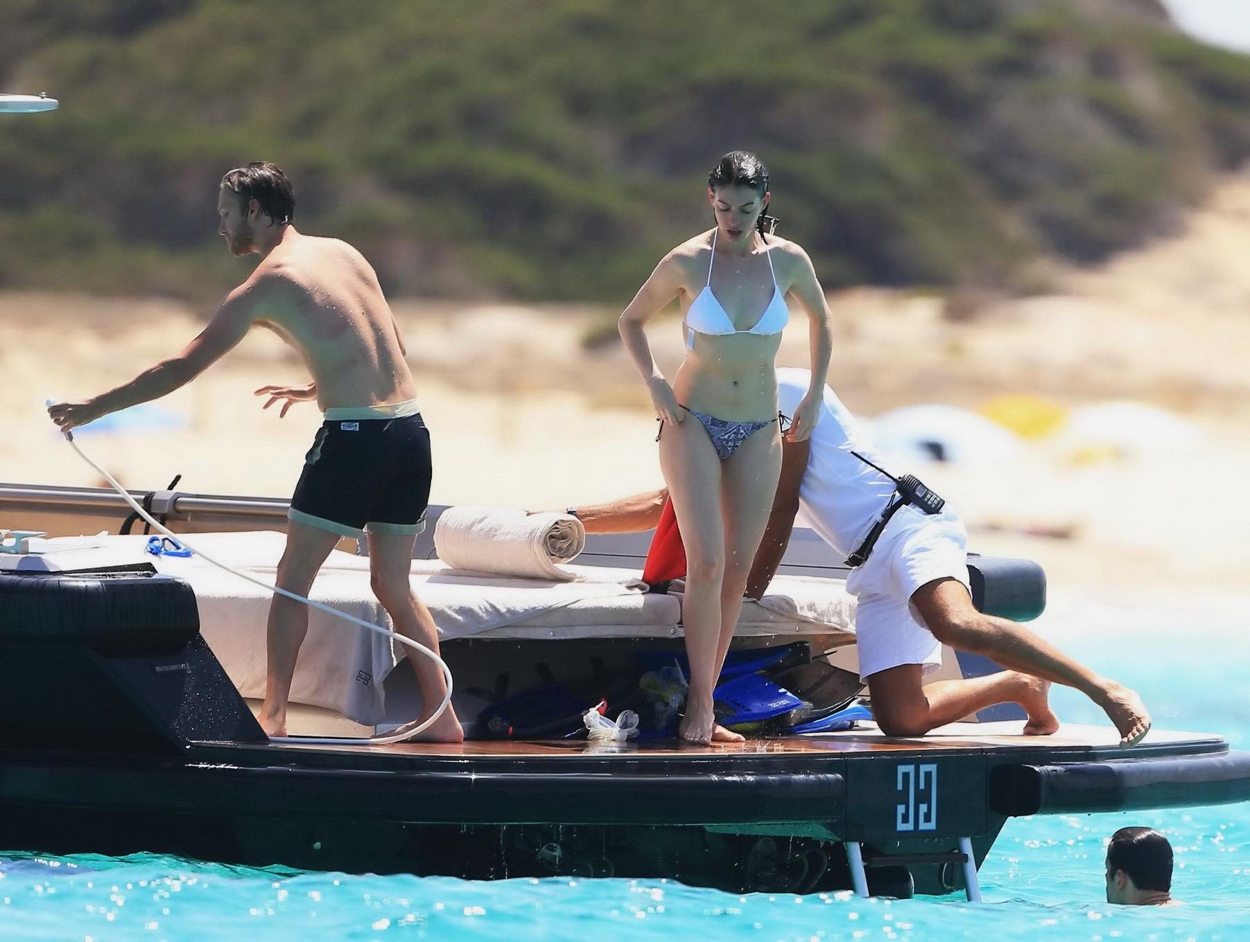 16P Anne Hathaway busty in a tiny twopiece at the yacht