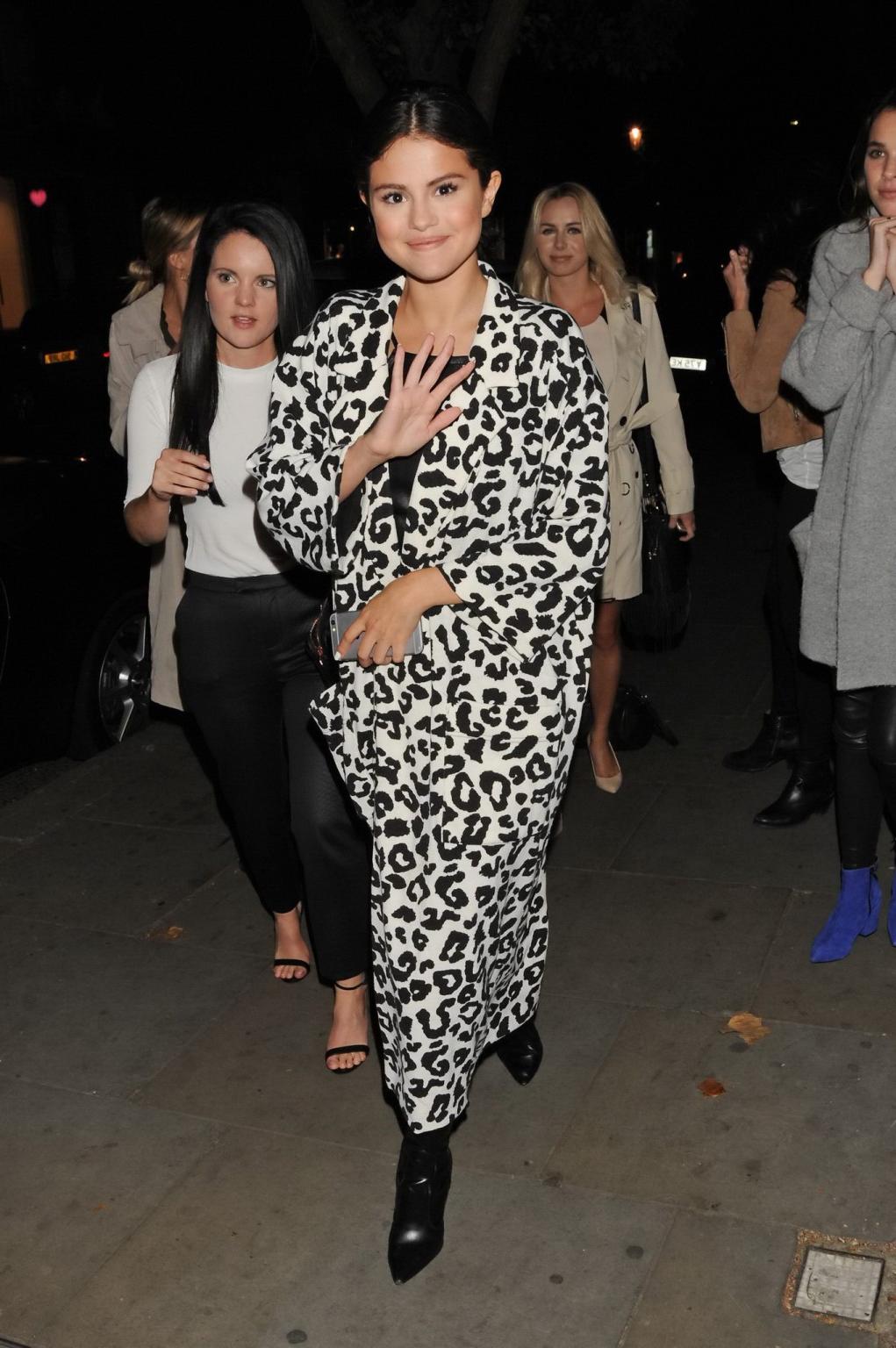 16P Selena Gomez busty wearing tight black leather in London