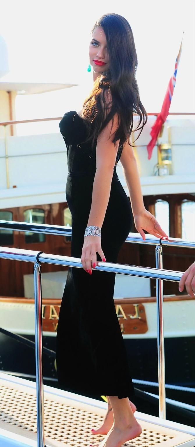 16P Adriana Lima busty in black strapless dress boarding on a yacht in Cannes