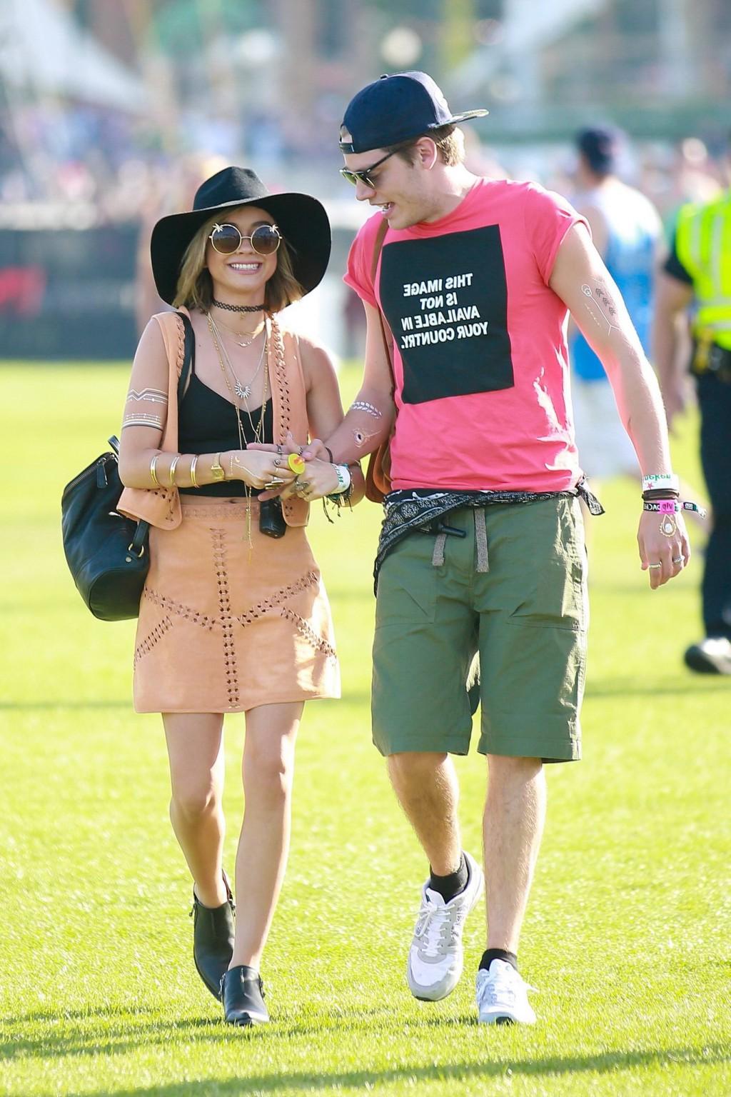 16P Sarah Hyland cleavy and leggy in black top and leather mini skirt at Coachella V