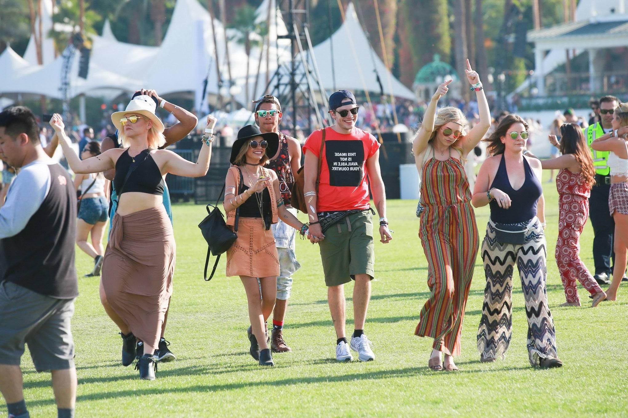 16P Sarah Hyland cleavy and leggy in black top and leather mini skirt at Coachella V