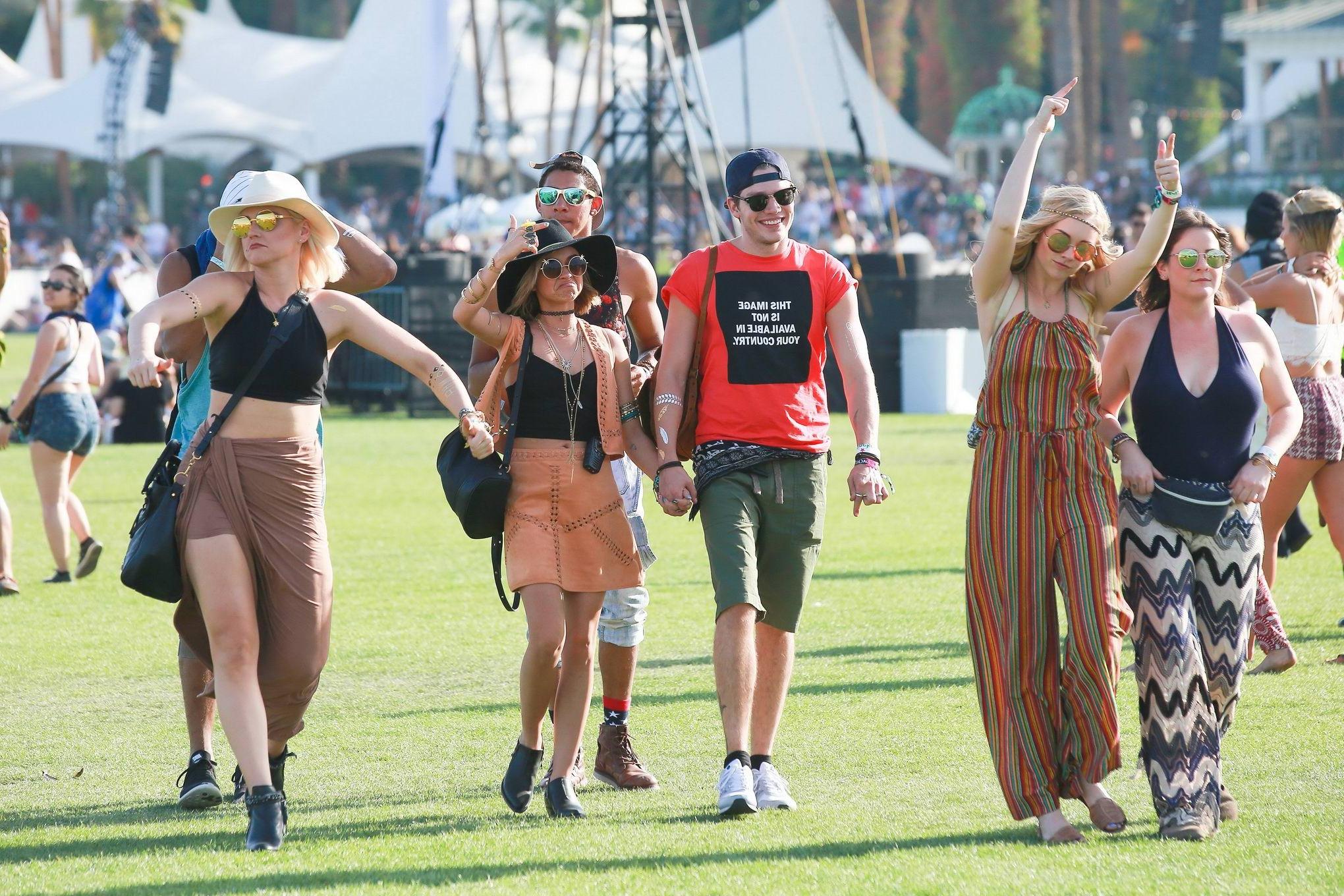 16P Sarah Hyland cleavy and leggy in black top and leather mini skirt at Coachella V