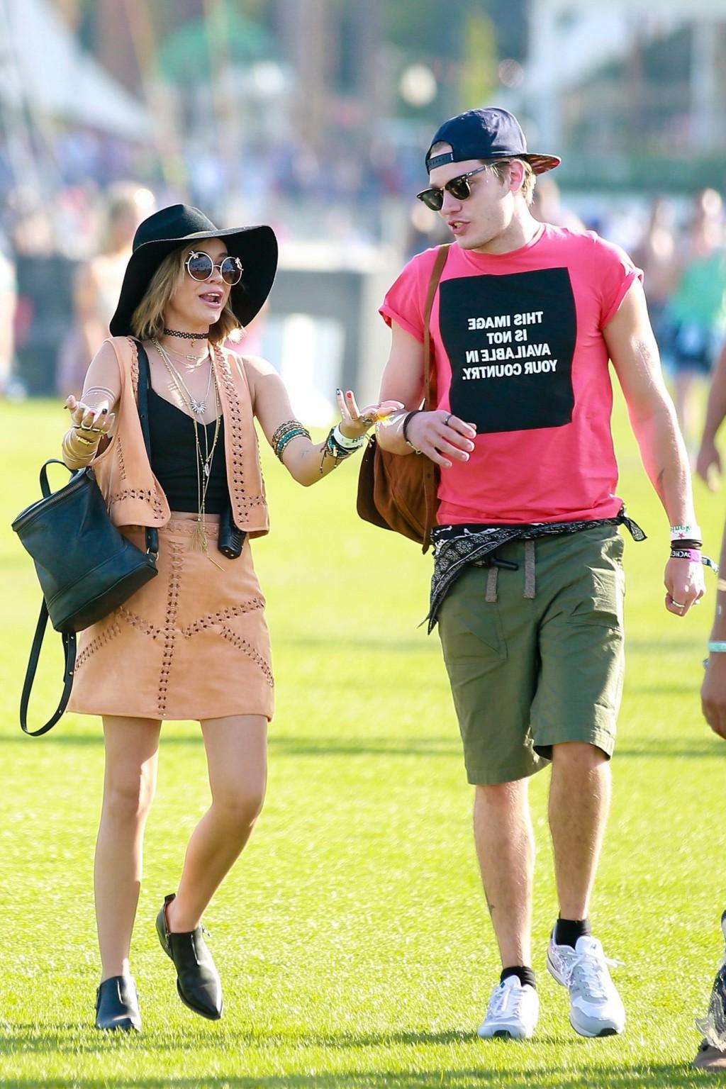 16P Sarah Hyland cleavy and leggy in black top and leather mini skirt at Coachella V