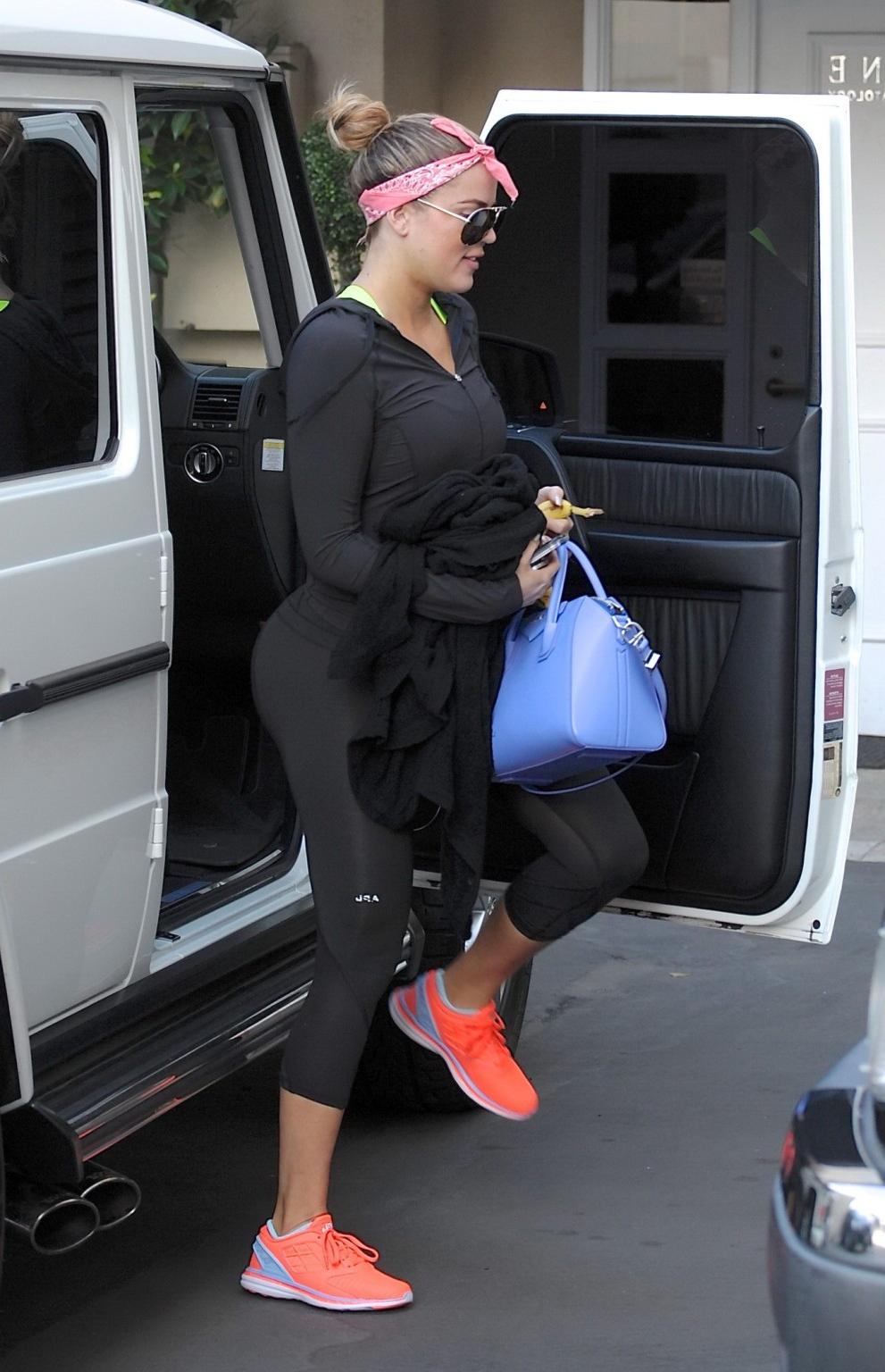 16P Khloe Kardashian showing off her big booty in black tights after a workout in Be