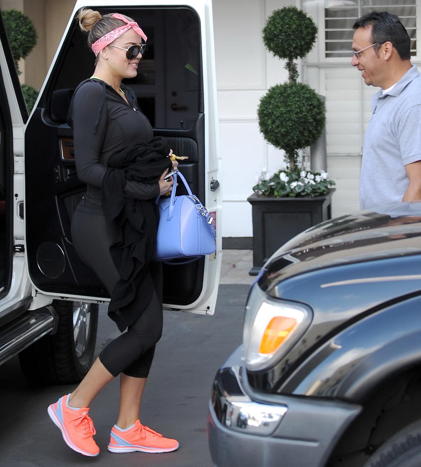 16P Khloe Kardashian showing off her big booty in black tights after a workout in Be