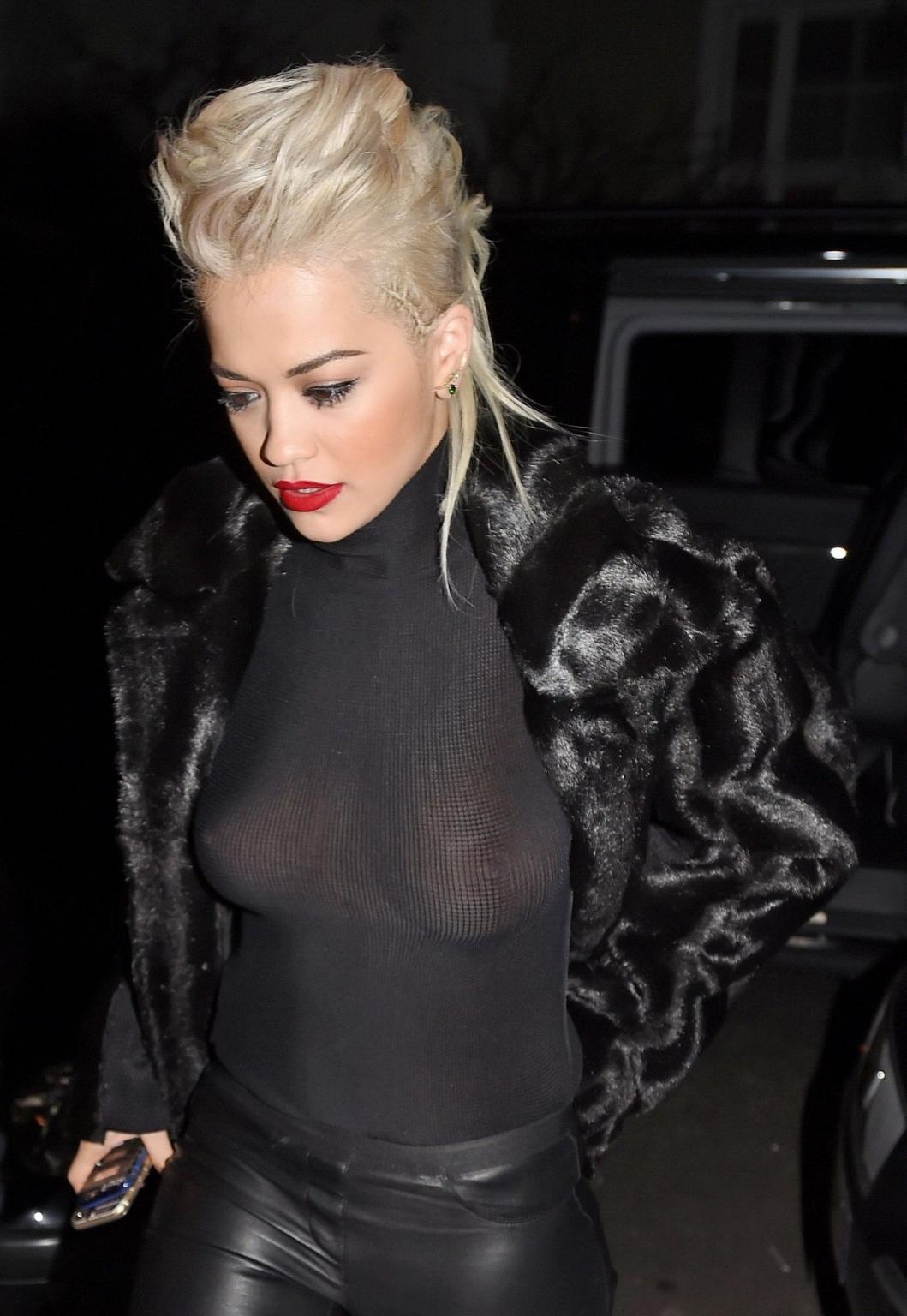 16P Rita Ora showing boobs in seethru top and leather pants at the Shepherds Bush Em