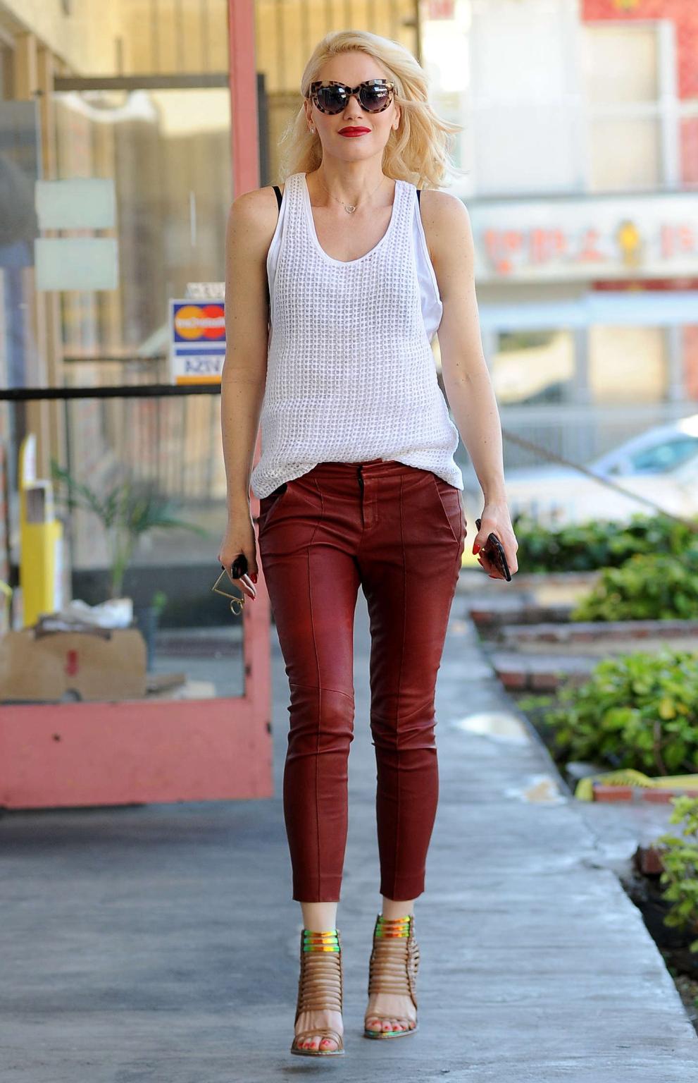 16P Gwen Stefani busty in white see through top and red leather pants arriving to he