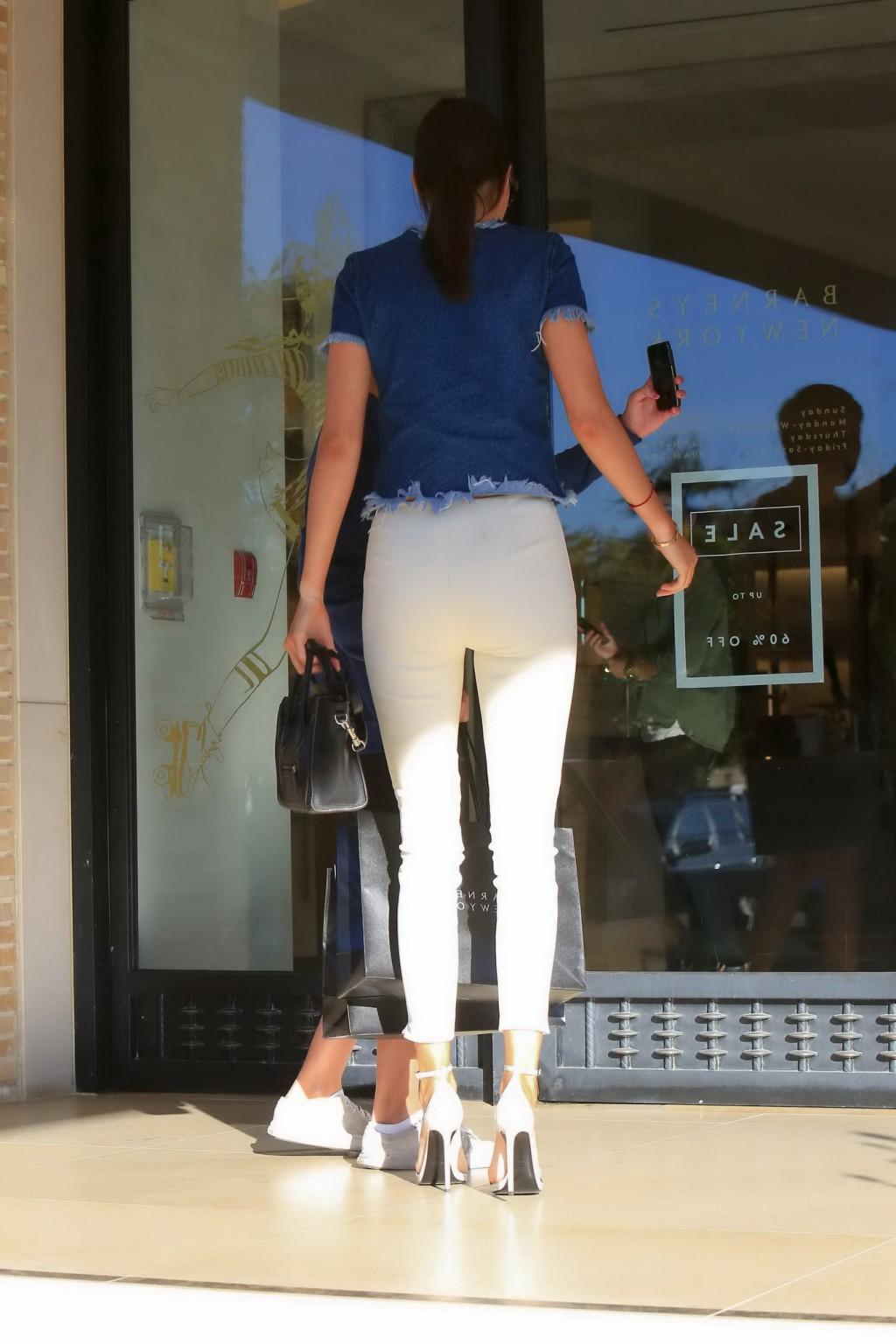 16P Kendall Jenner showing ass in tight white pants and denim top while shopping in 