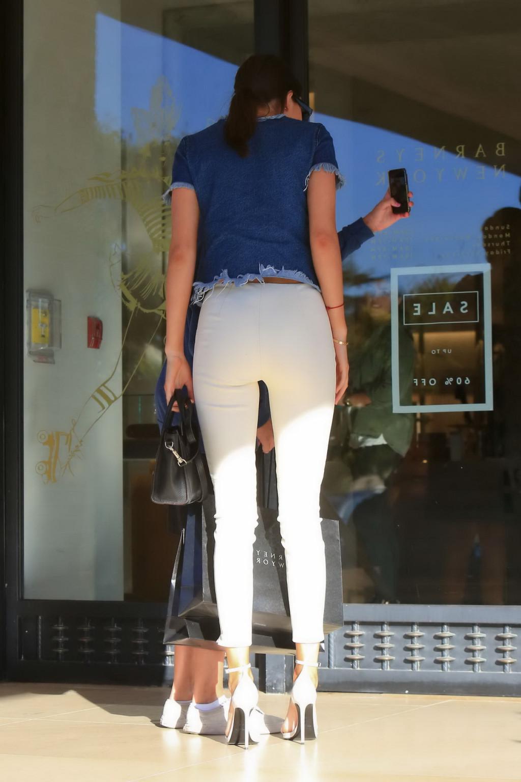 16P Kendall Jenner showing ass in tight white pants and denim top while shopping in 