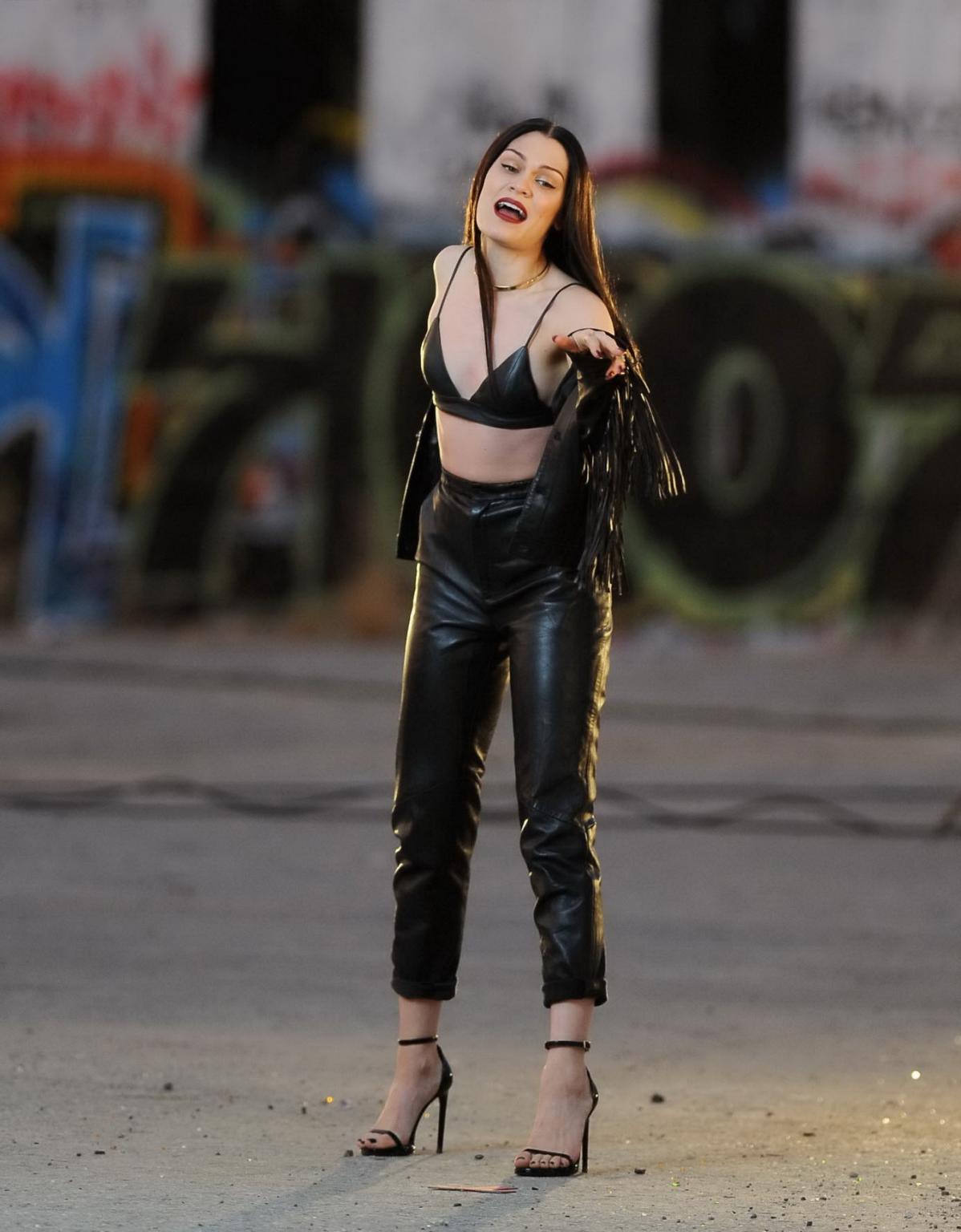 16P Jessie J showing boobs in tiny black leather bra on the set of her new music vid