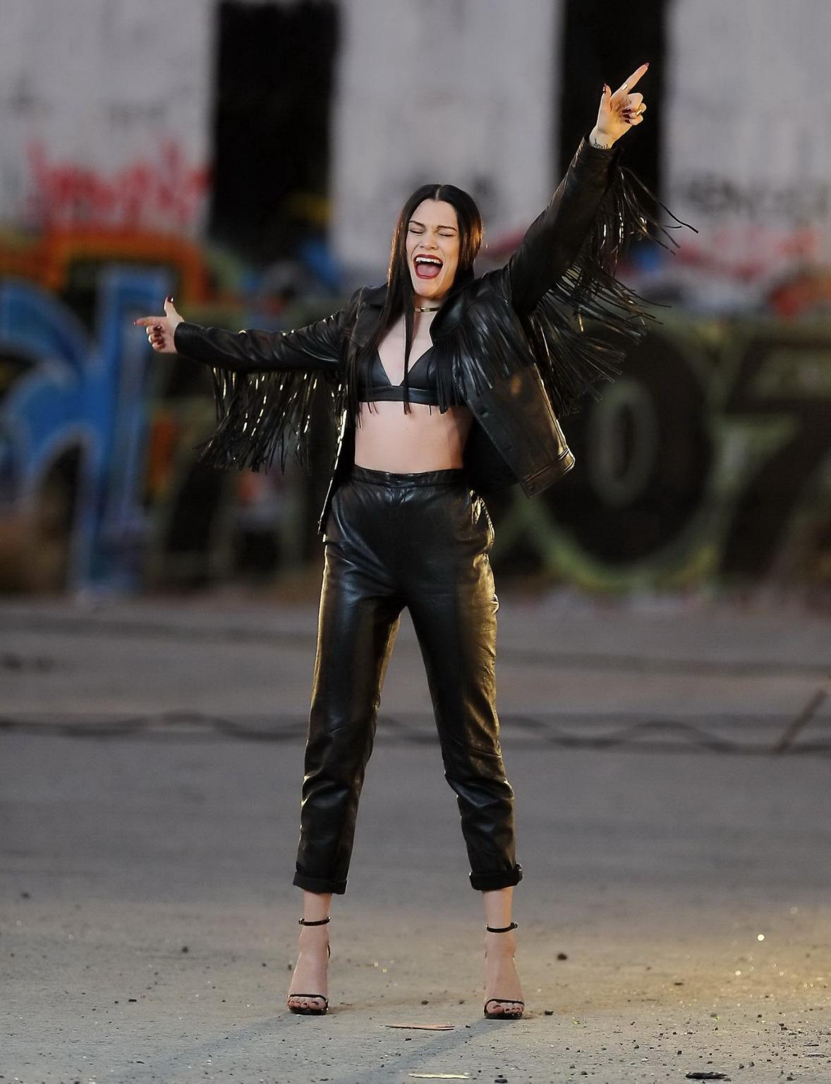 16P Jessie J showing boobs in tiny black leather bra on the set of her new music vid