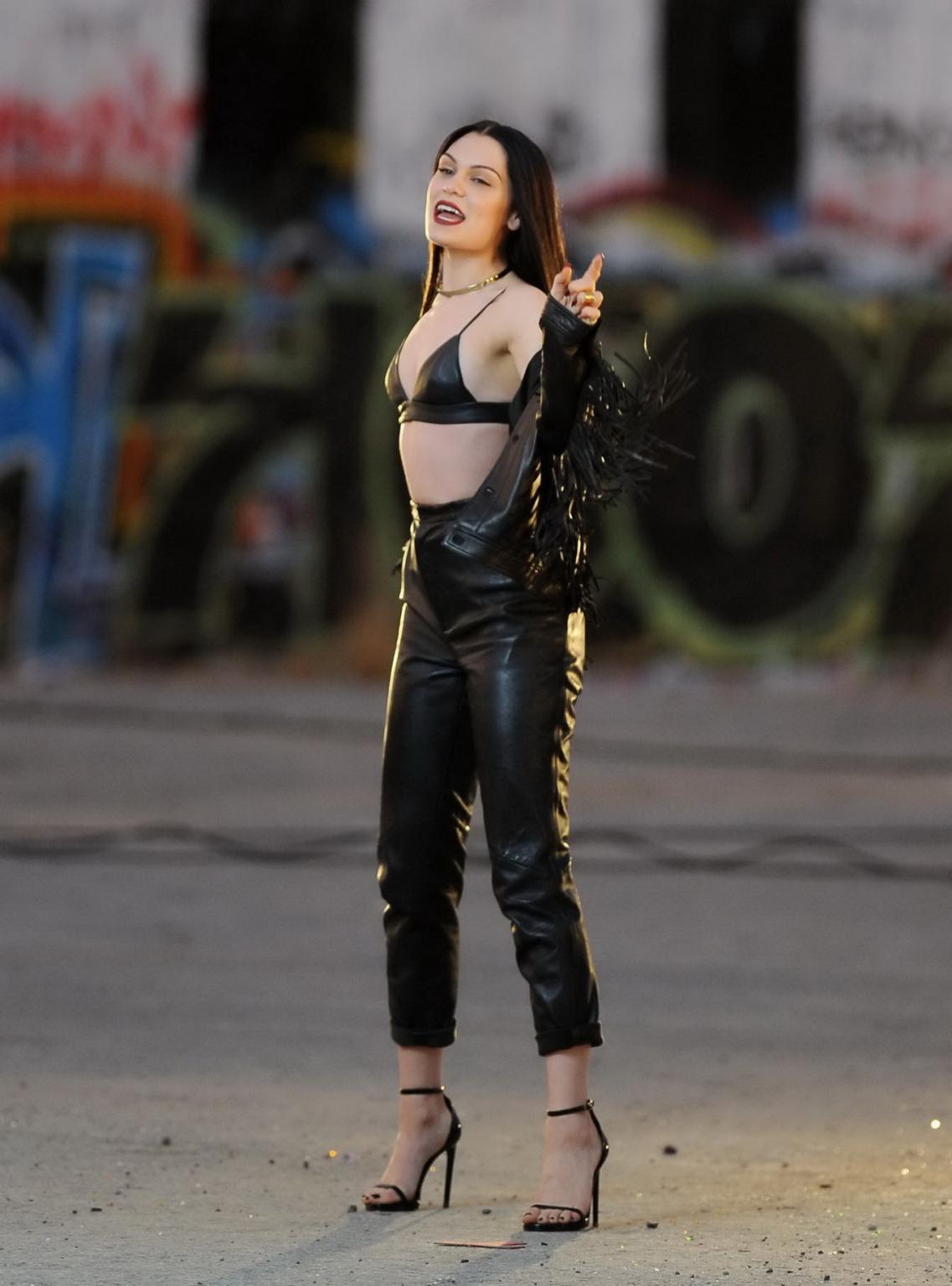 16P Jessie J showing boobs in tiny black leather bra on the set of her new music vid
