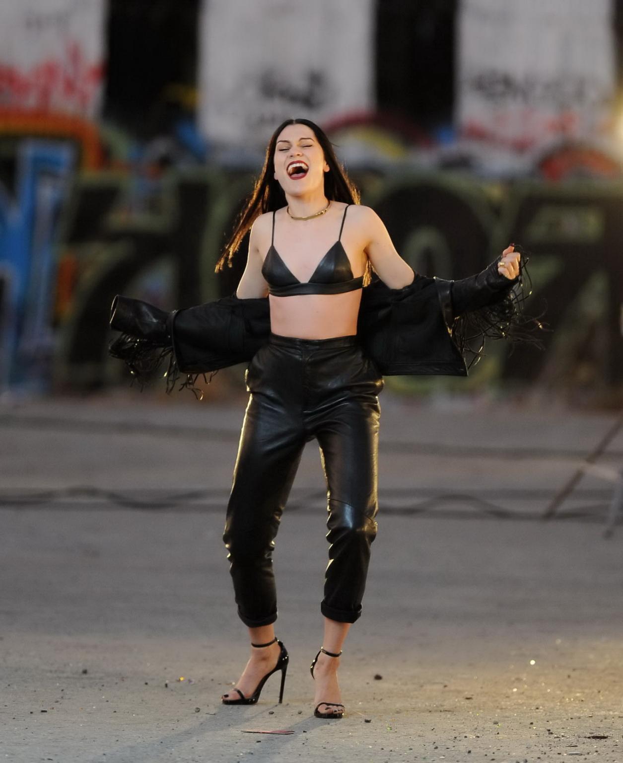 16P Jessie J showing boobs in tiny black leather bra on the set of her new music vid