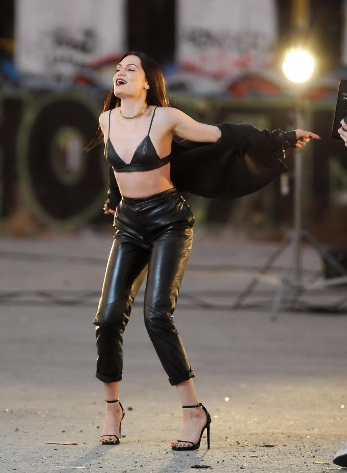 16P Jessie J showing boobs in tiny black leather bra on the set of her new music vid