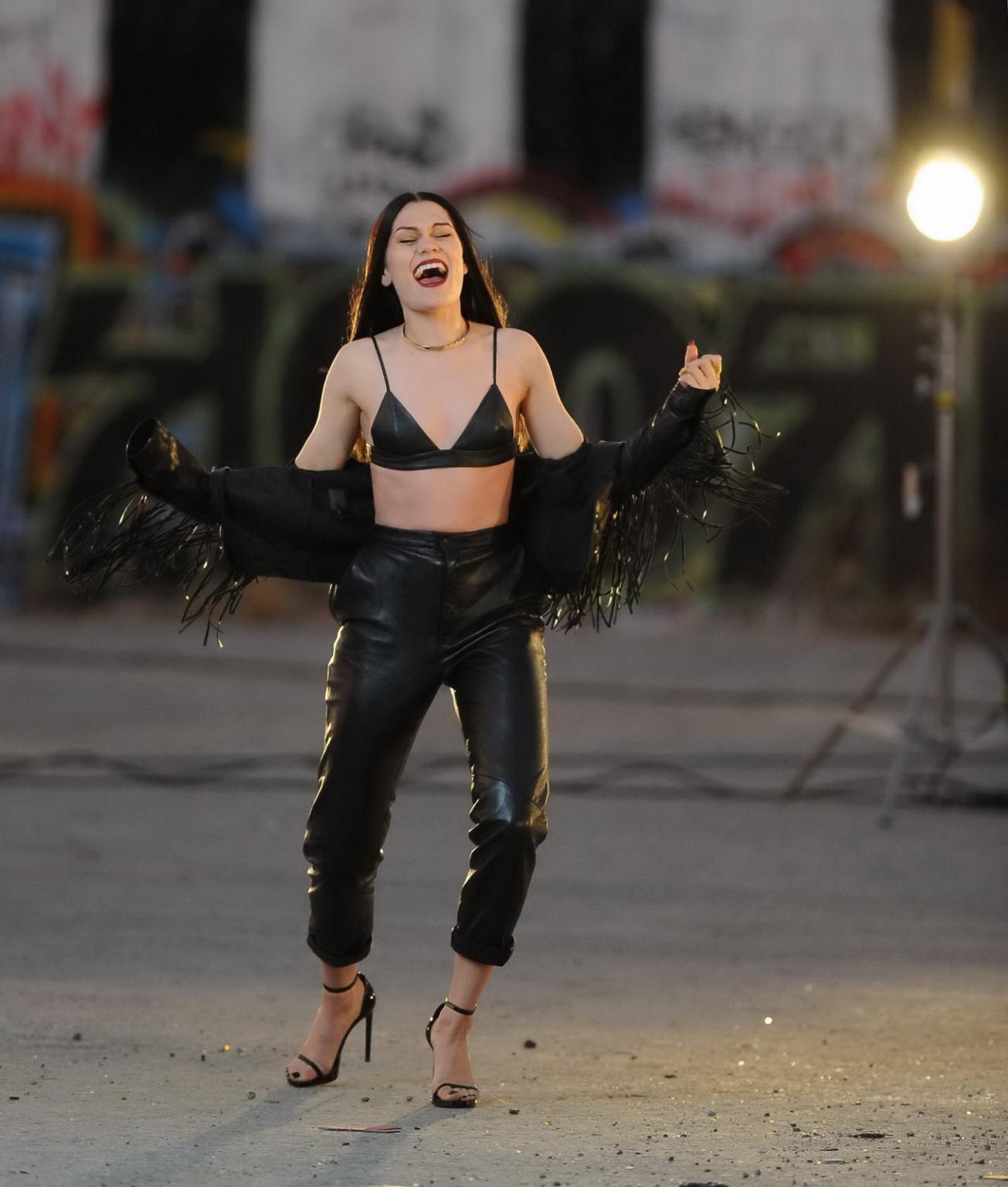 16P Jessie J showing boobs in tiny black leather bra on the set of her new music vid