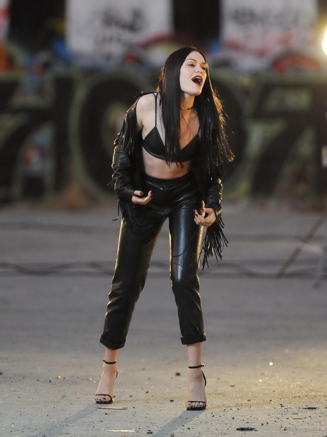 16P Jessie J showing boobs in tiny black leather bra on the set of her new music vid