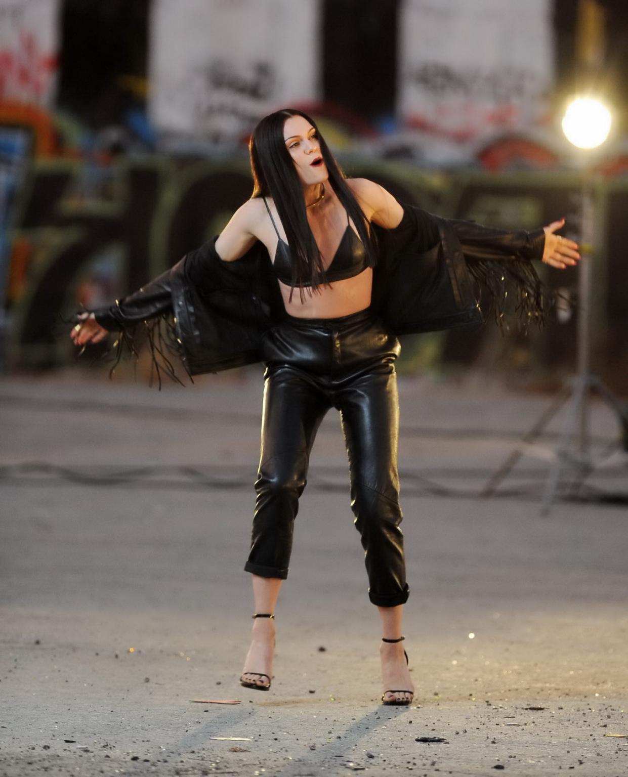 16P Jessie J showing boobs in tiny black leather bra on the set of her new music vid
