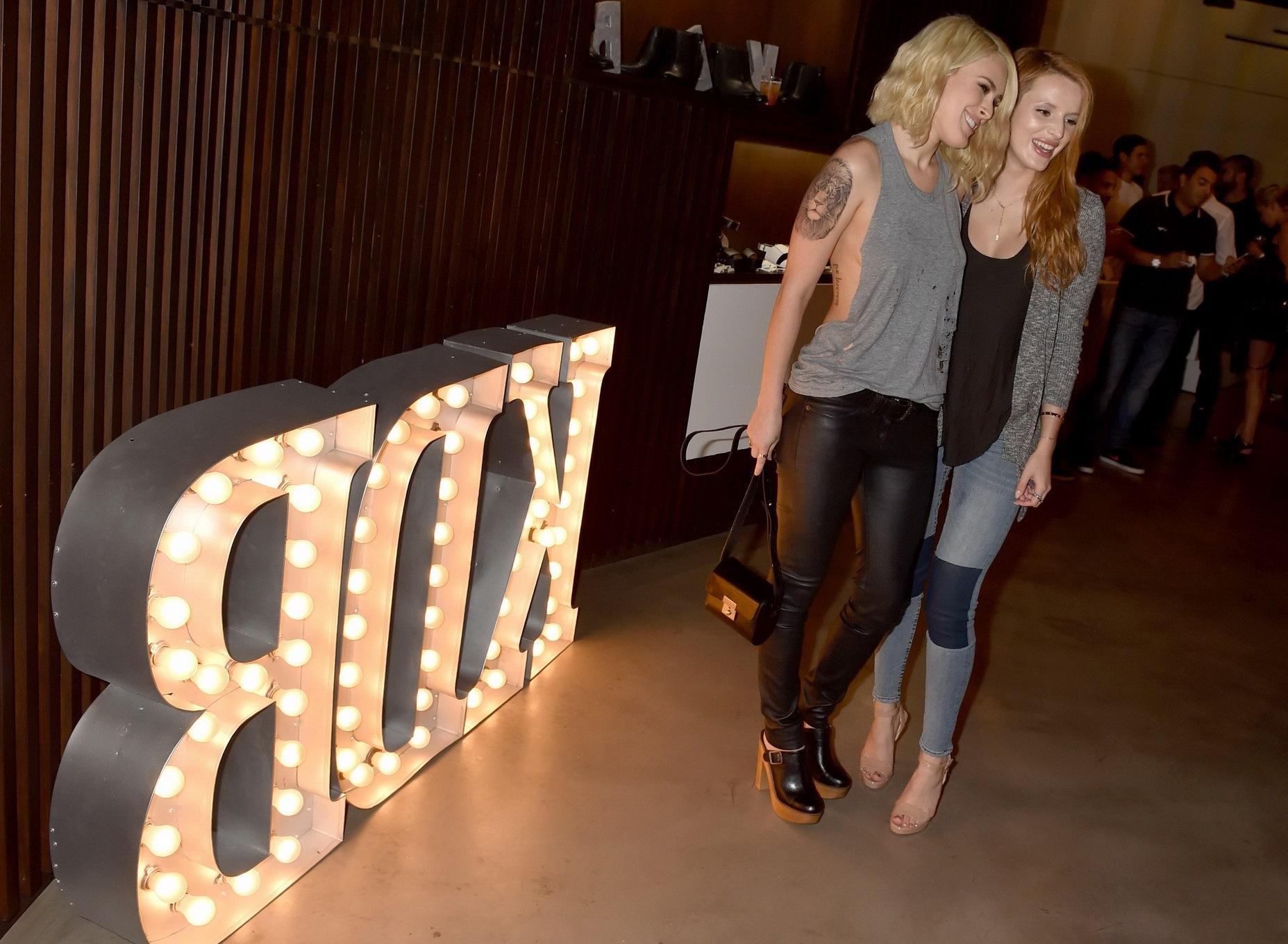 16P Rumer Willis shows sideboob braless in a ripped top and leather pants at the eve