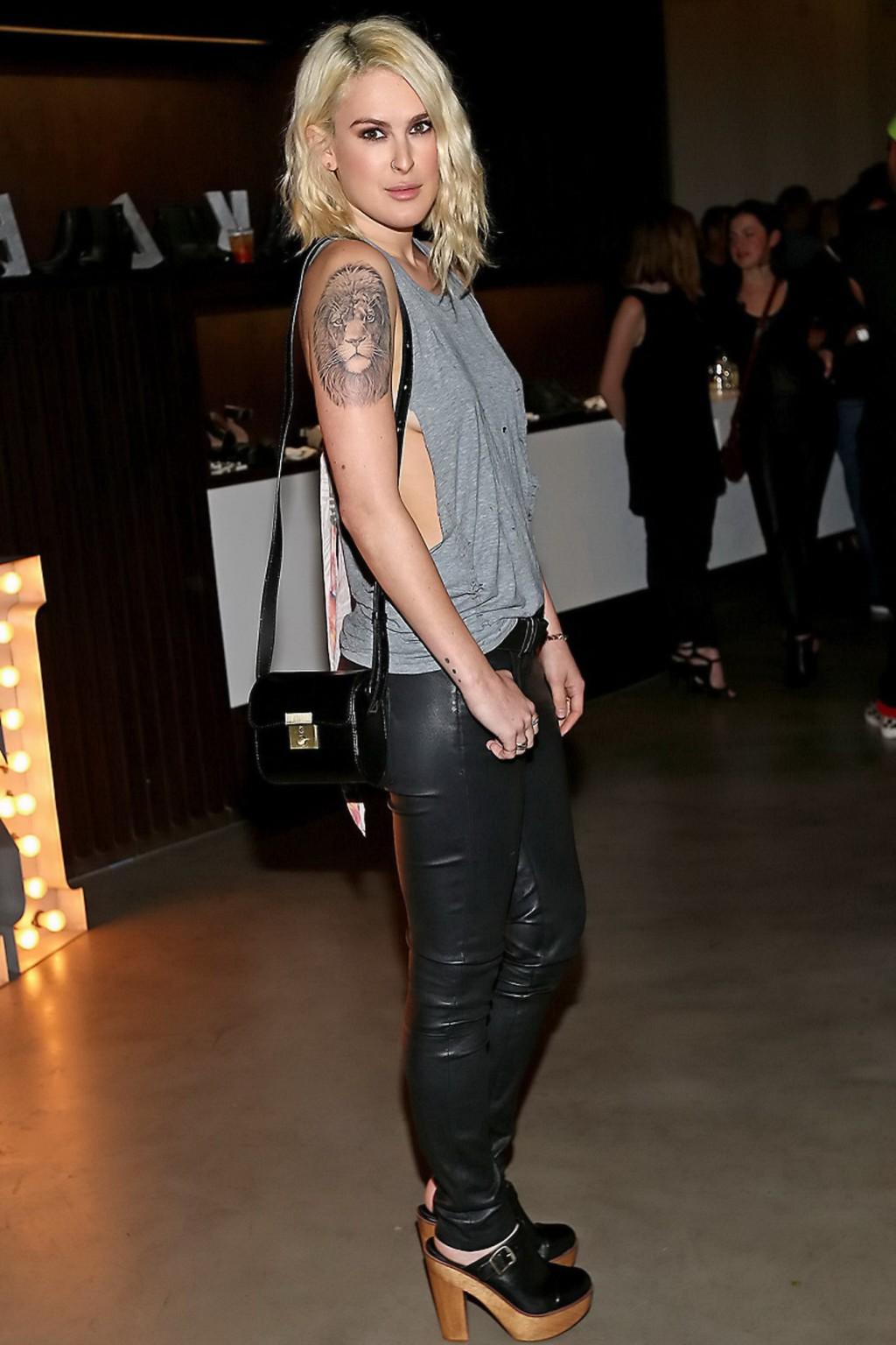 16P Rumer Willis shows sideboob braless in a ripped top and leather pants at the eve