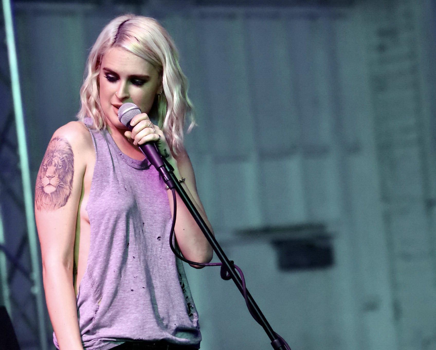 16P Rumer Willis shows sideboob braless in a ripped top and leather pants at the eve