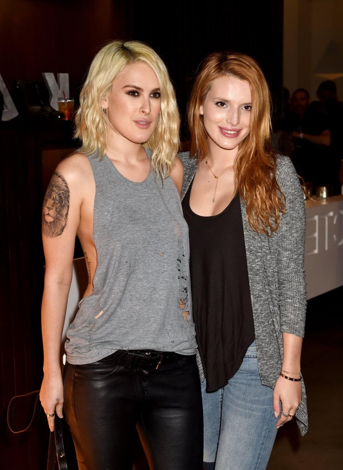 16P Rumer Willis shows sideboob braless in a ripped top and leather pants at the eve