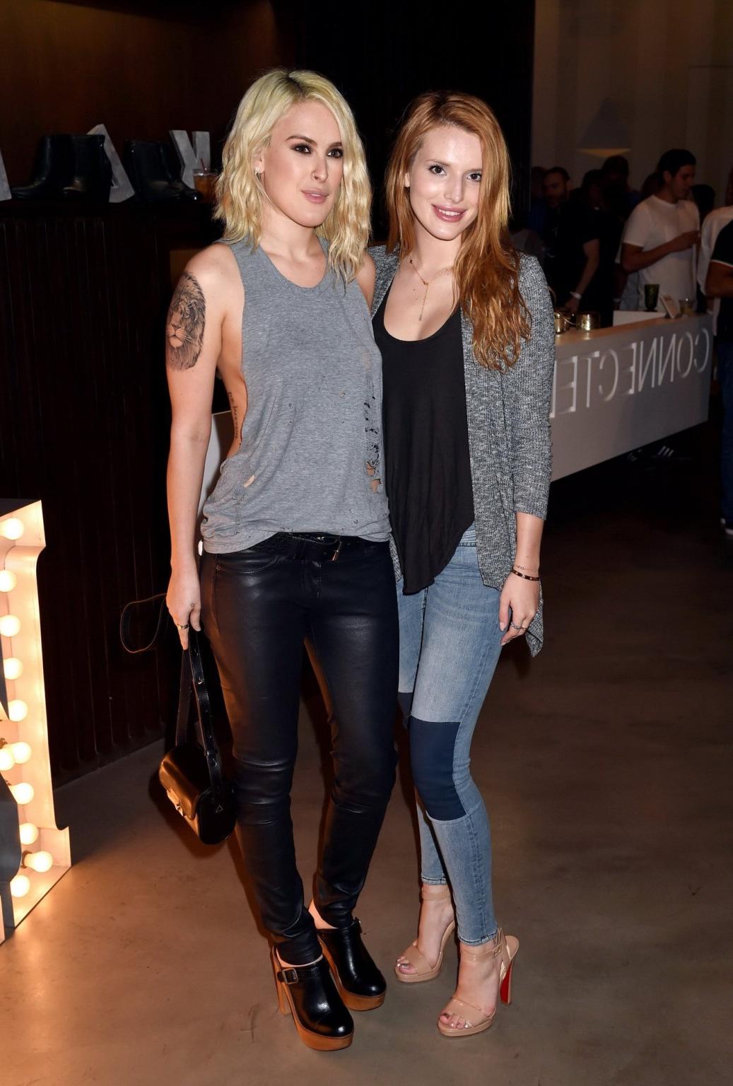 16P Rumer Willis shows sideboob braless in a ripped top and leather pants at the eve