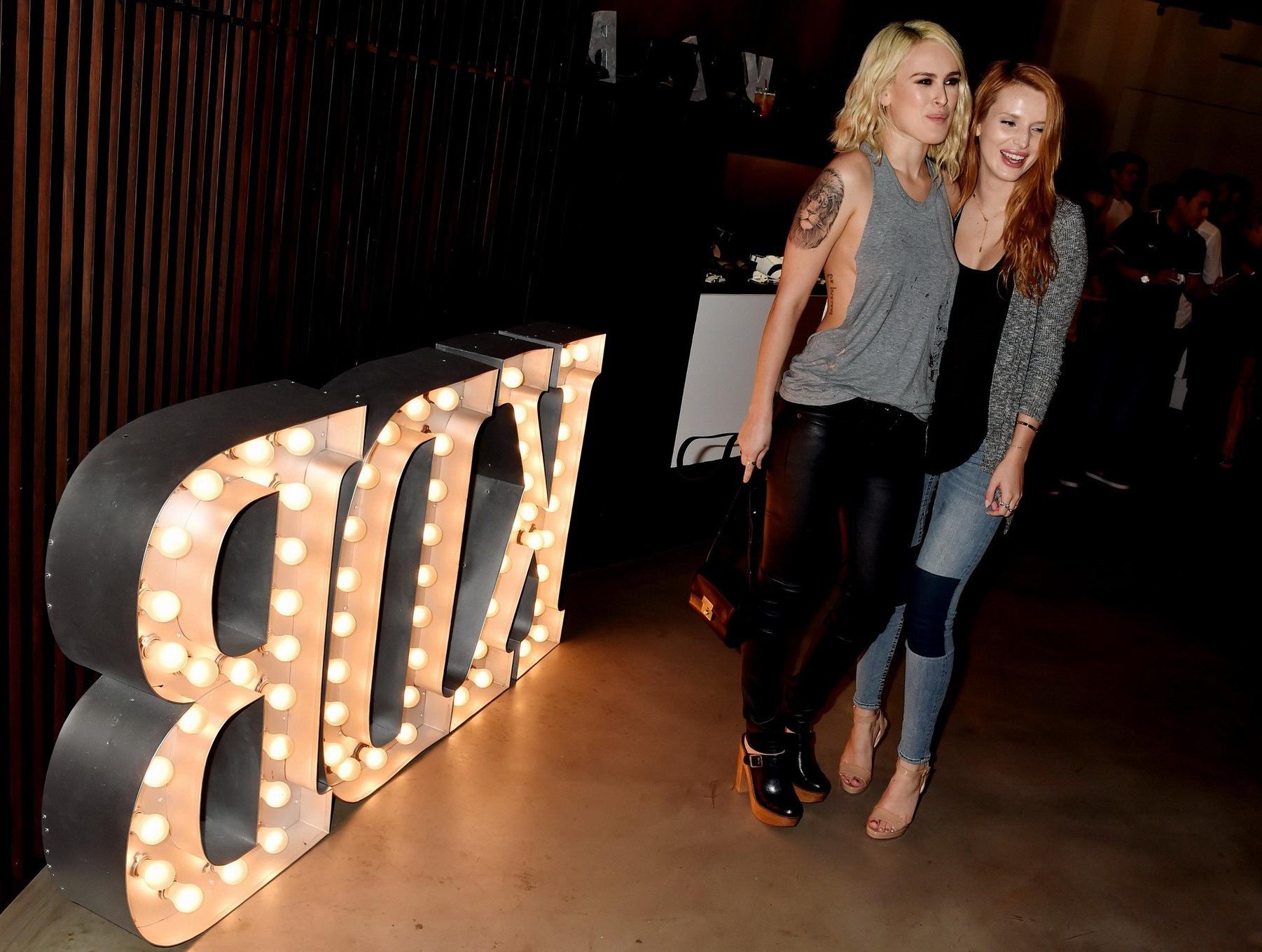 16P Rumer Willis shows sideboob braless in a ripped top and leather pants at the eve