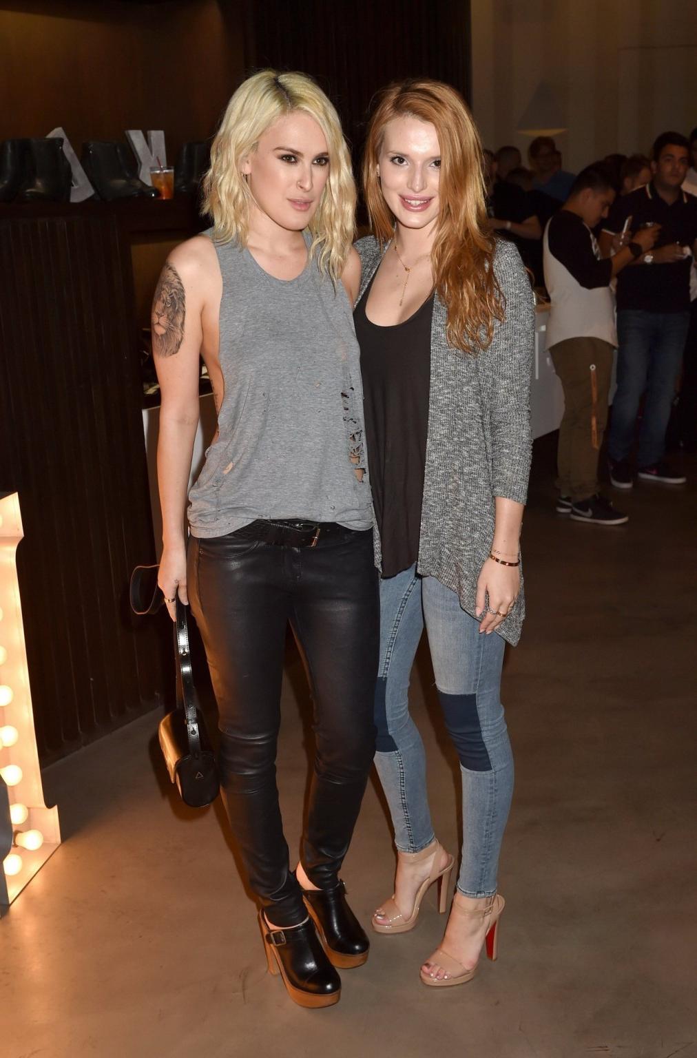 16P Rumer Willis shows sideboob braless in a ripped top and leather pants at the eve