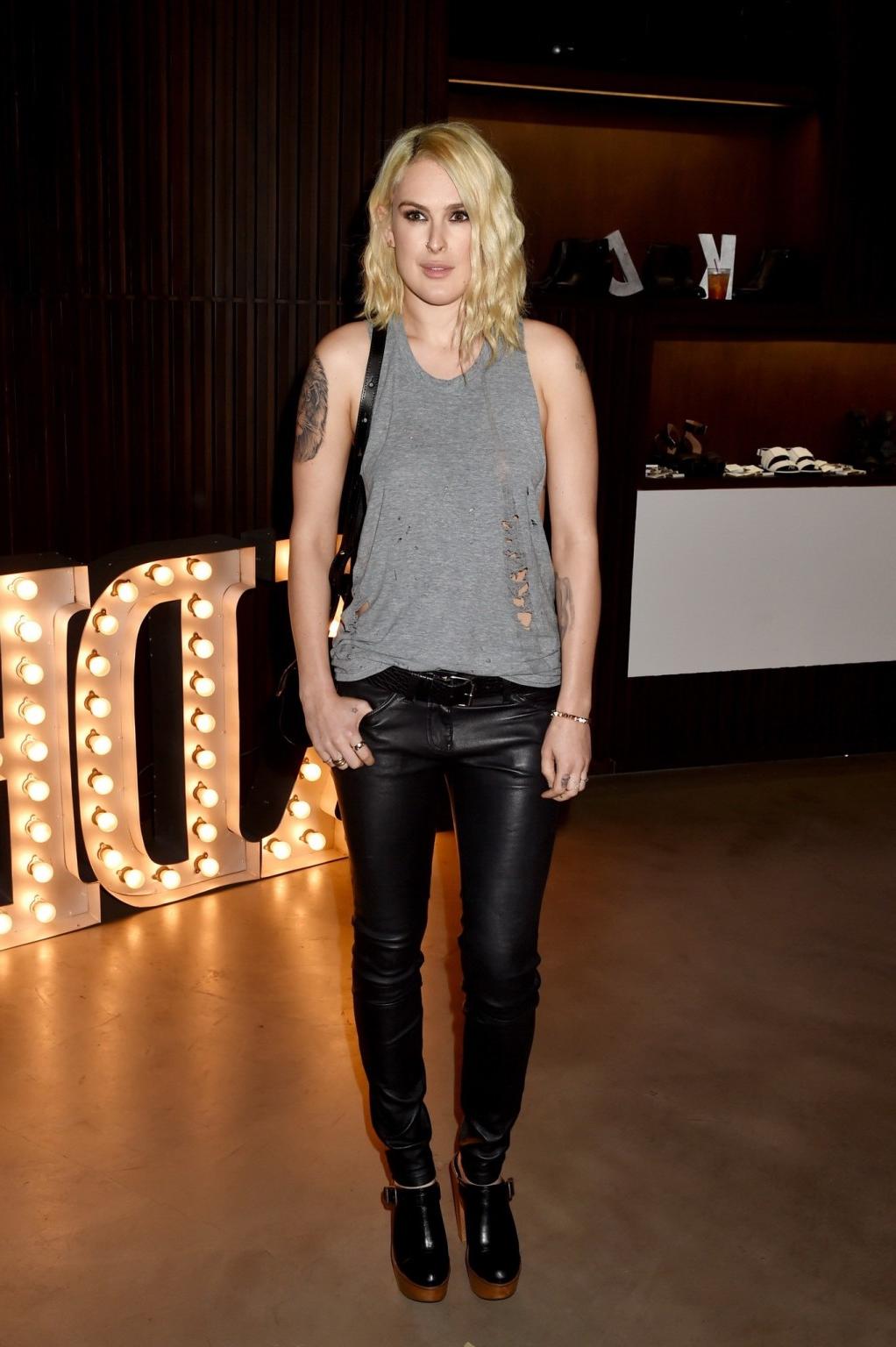 16P Rumer Willis shows sideboob braless in a ripped top and leather pants at the eve