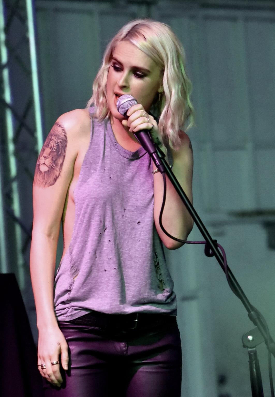 16P Rumer Willis shows sideboob braless in a ripped top and leather pants at the eve