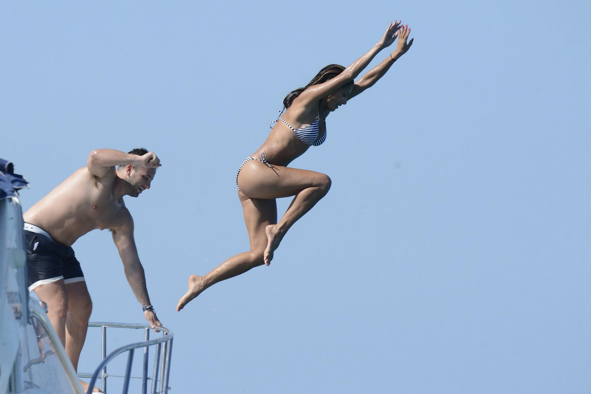 16P Nicole Scherzinger shows off her round ass in skimpy striped bikini on the yacht