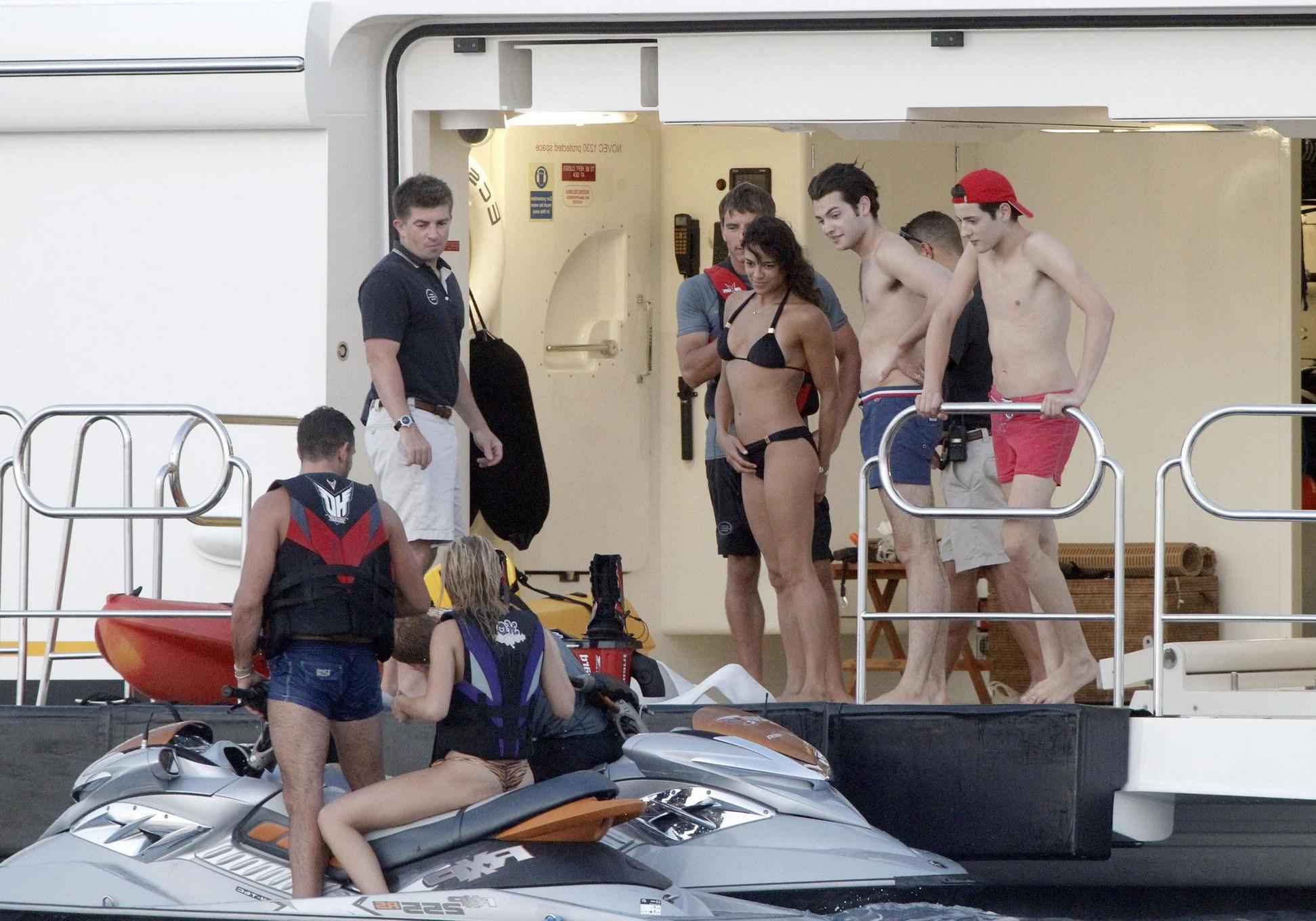 16P Michelle Rodriguez wearing a sexy black bikini on a yacht in Formentera