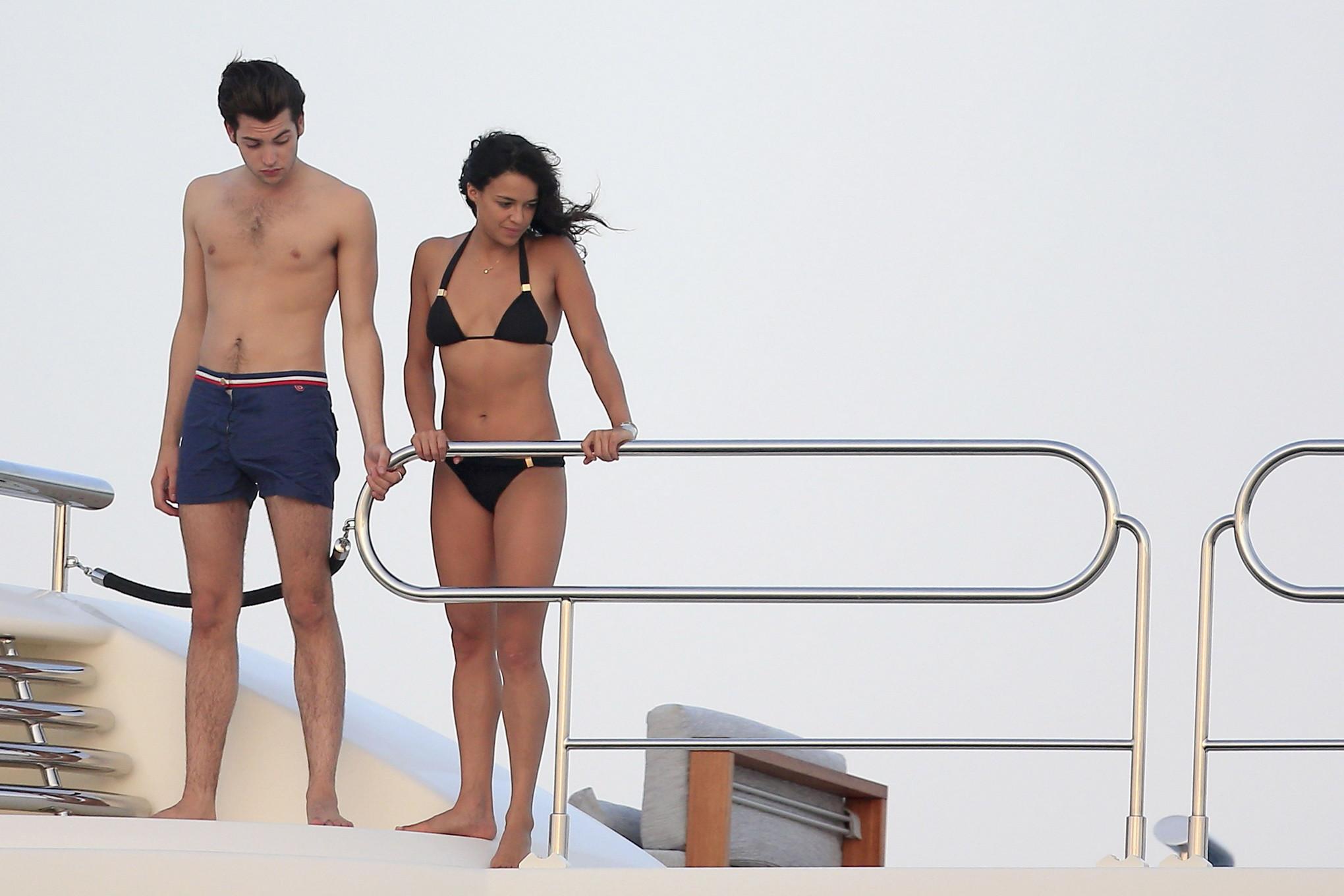 16P Michelle Rodriguez wearing a sexy black bikini on a yacht in Formentera