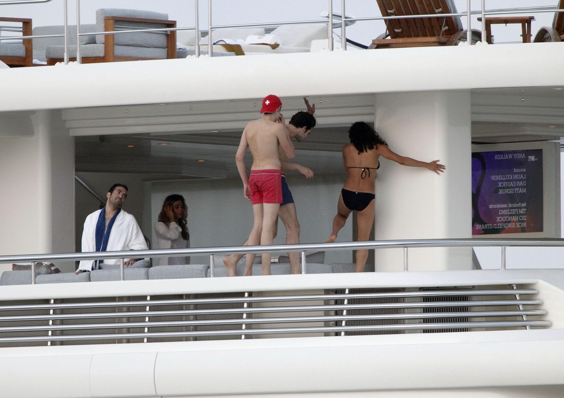 16P Michelle Rodriguez wearing a sexy black bikini on a yacht in Formentera