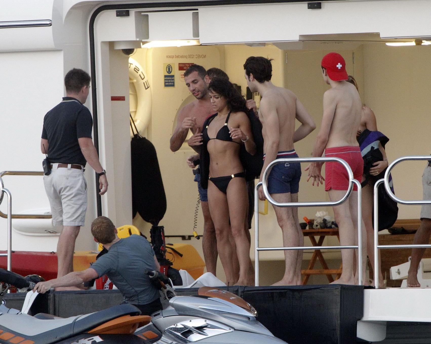 16P Michelle Rodriguez wearing a sexy black bikini on a yacht in Formentera