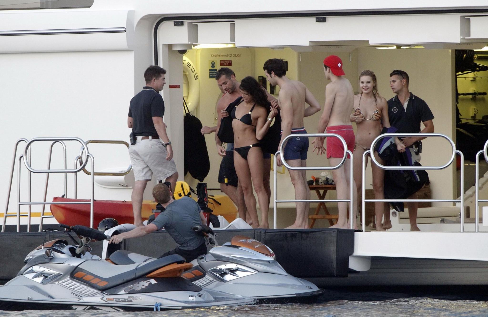 16P Michelle Rodriguez wearing a sexy black bikini on a yacht in Formentera