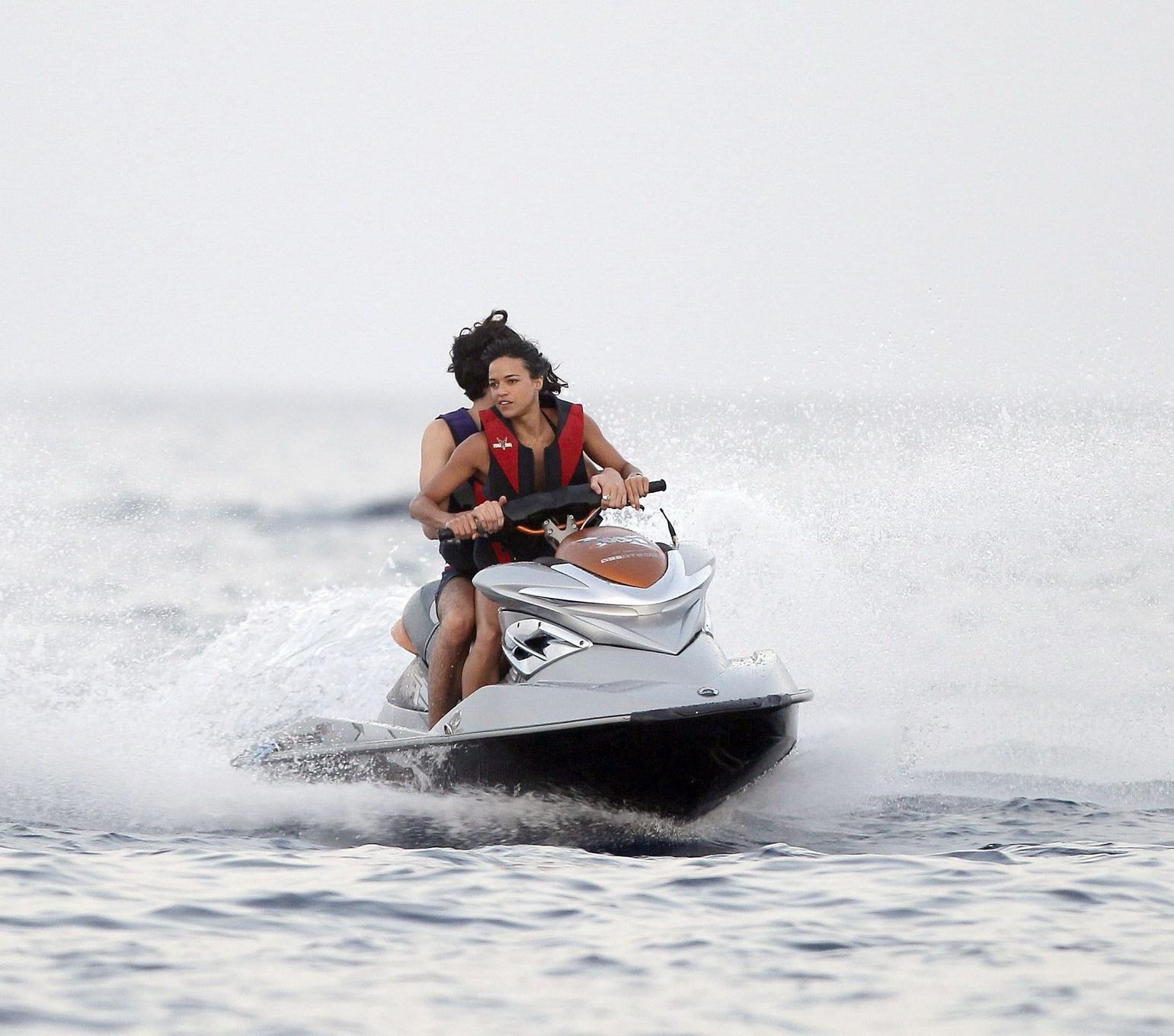 16P Michelle Rodriguez wearing a sexy black bikini on a yacht in Formentera