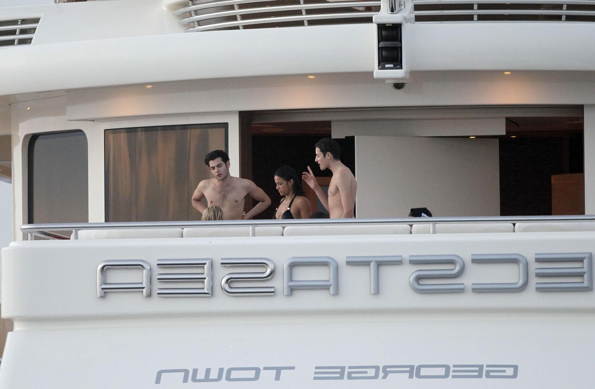 16P Michelle Rodriguez wearing a sexy black bikini on a yacht in Formentera