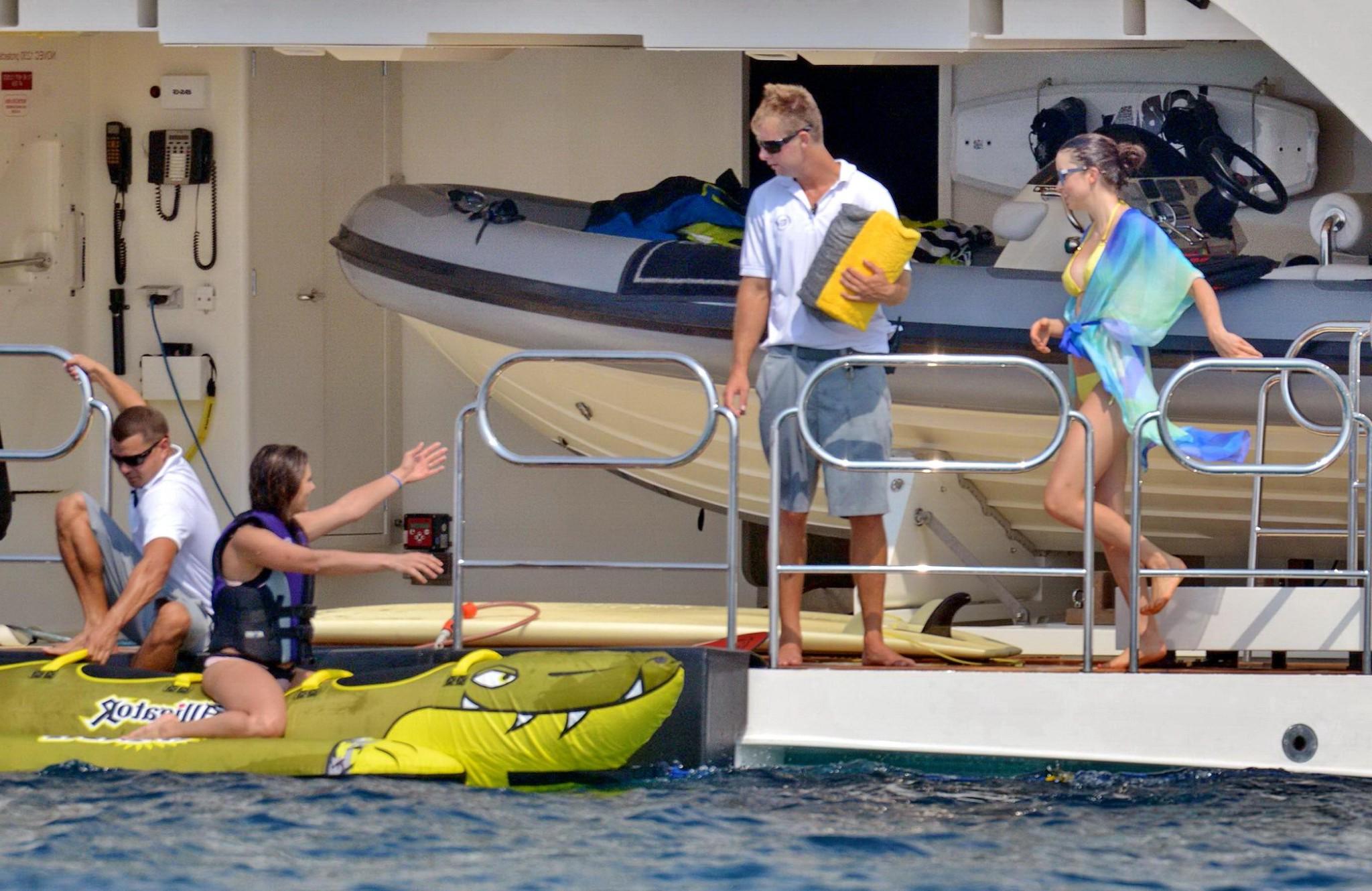 16P Nina Dobrev wearing a flesh colored bikini on a yacht in St Tropez