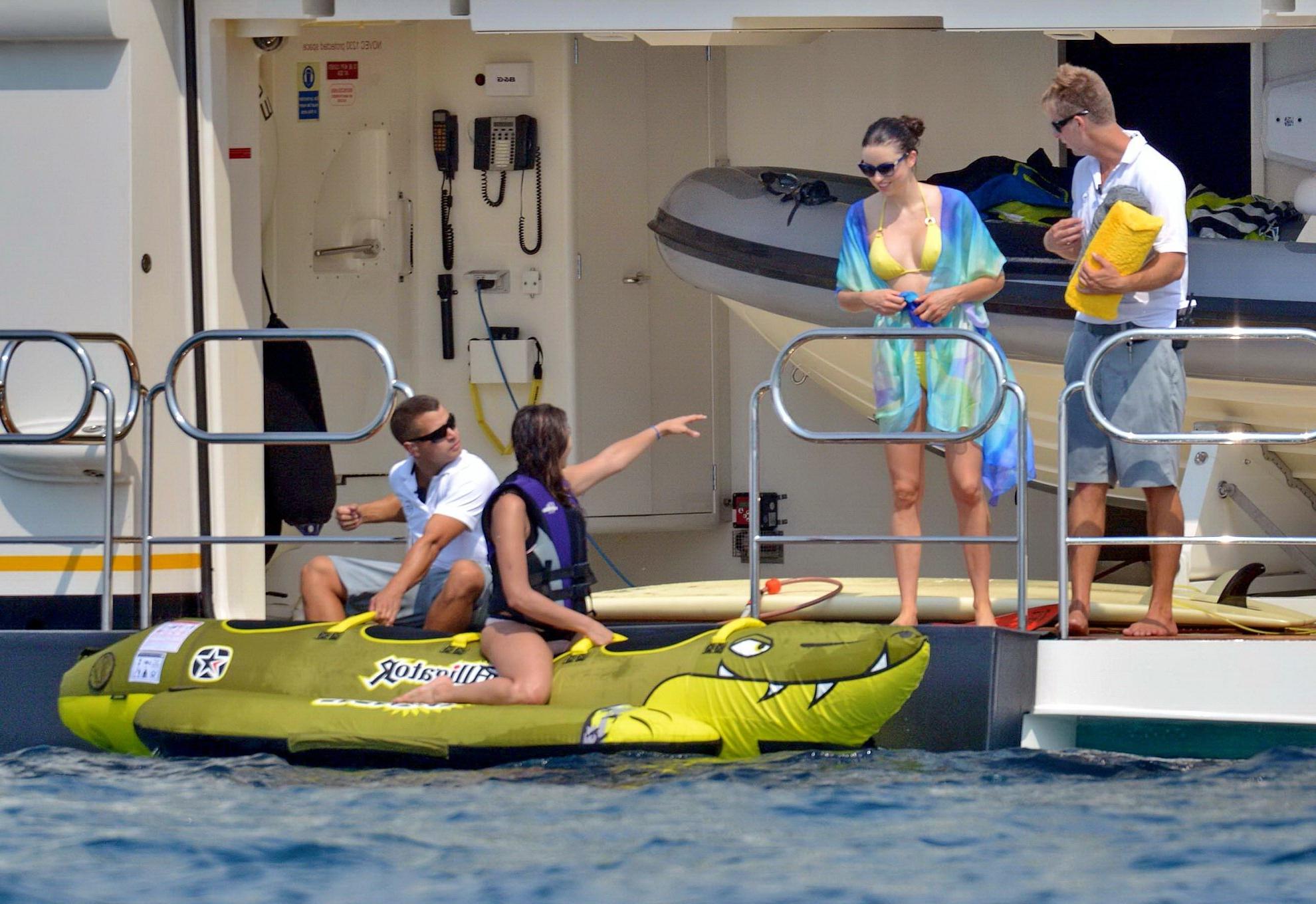 16P Nina Dobrev wearing a flesh colored bikini on a yacht in St Tropez