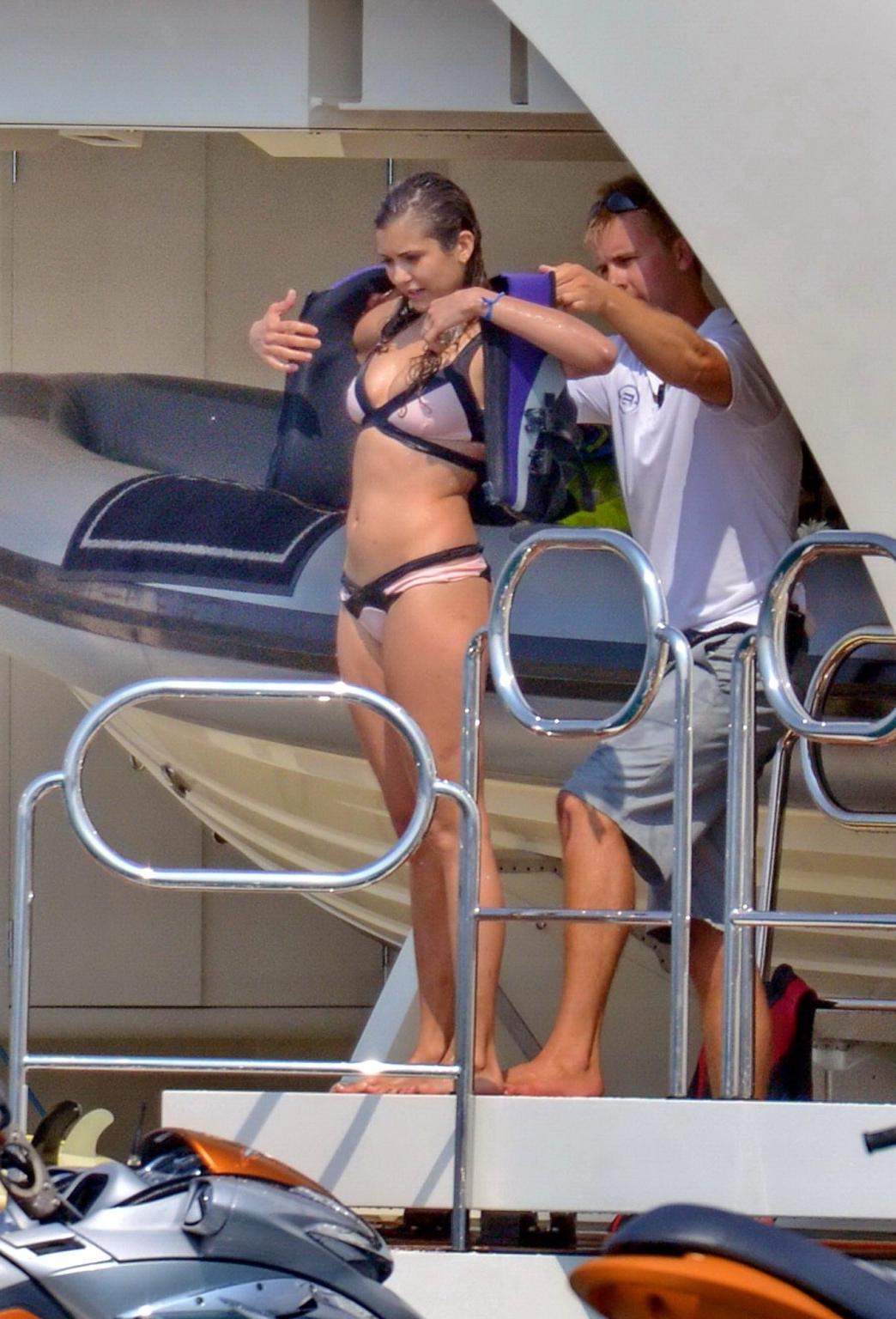 16P Nina Dobrev wearing a flesh colored bikini on a yacht in St Tropez