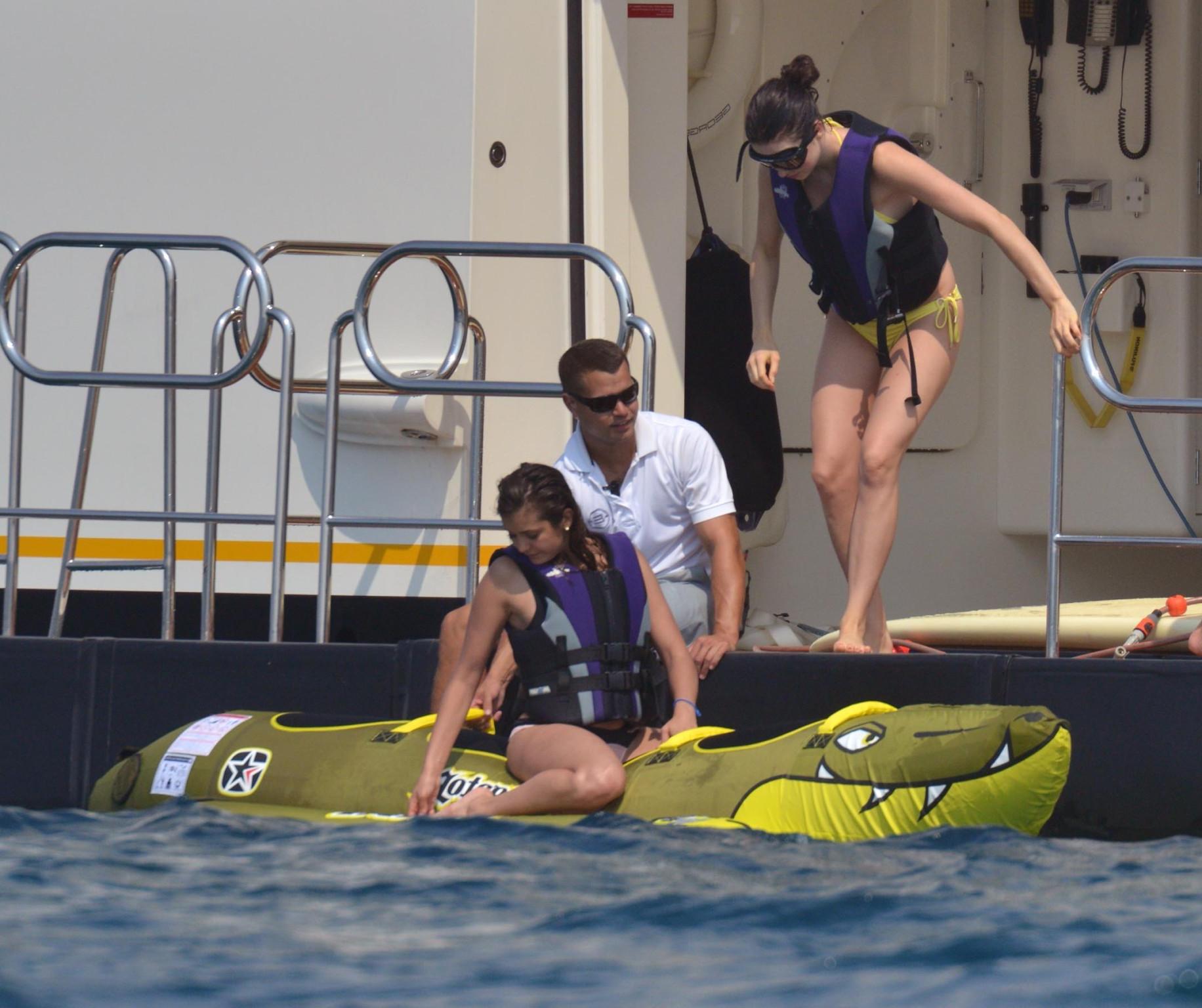16P Nina Dobrev wearing a flesh colored bikini on a yacht in St Tropez