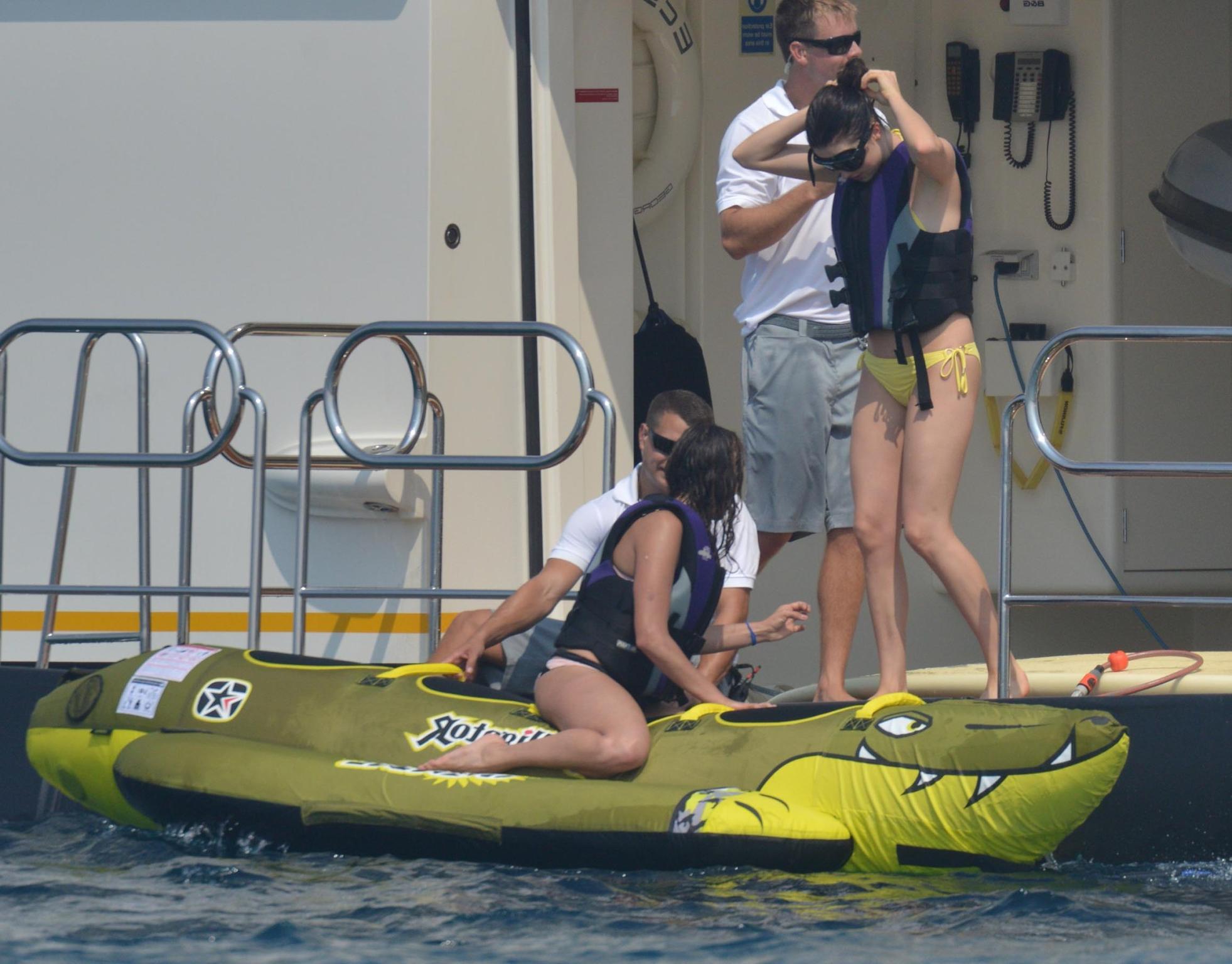 16P Nina Dobrev wearing a flesh colored bikini on a yacht in St Tropez